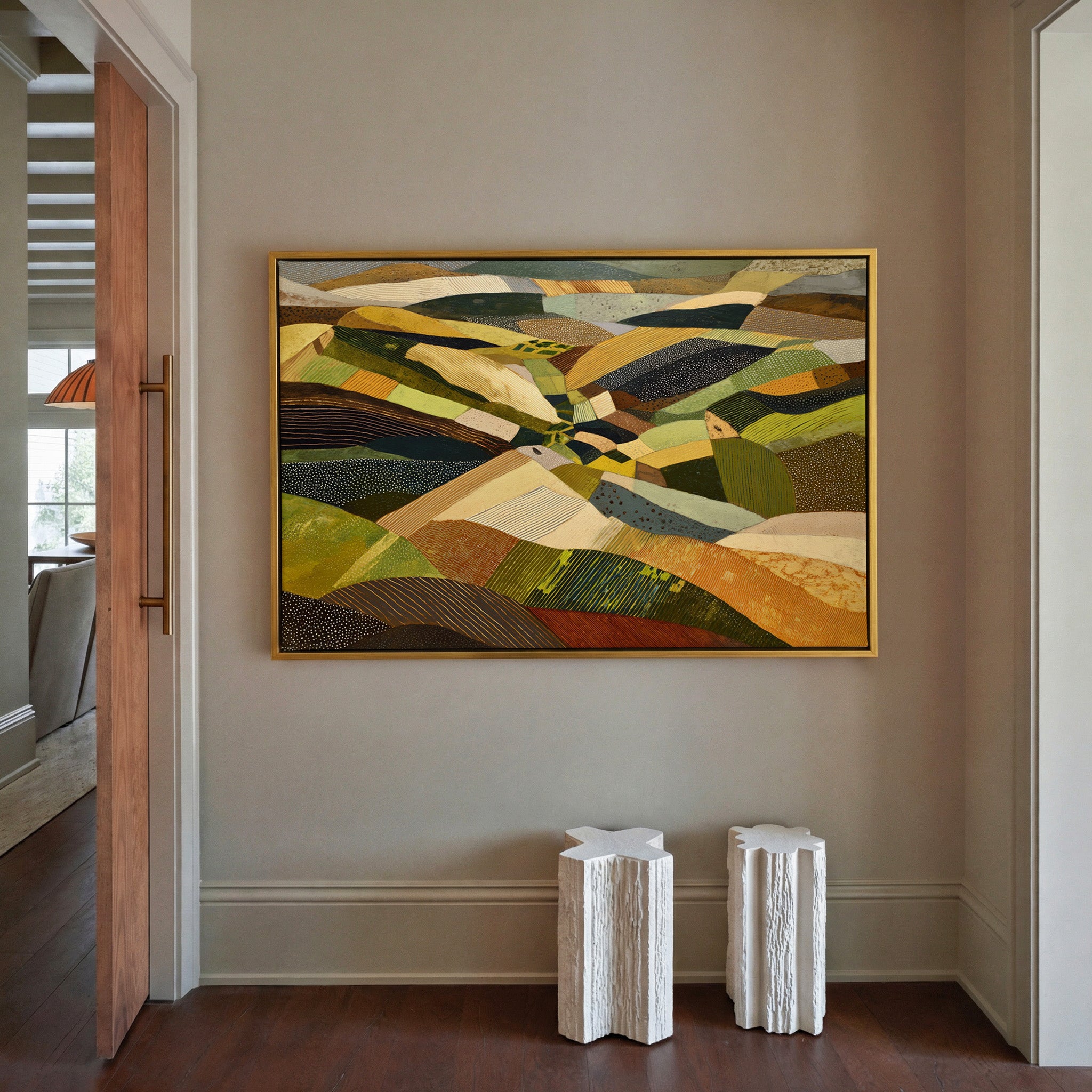 rolling abstract aerial landscape in olive, canvas wall art in a gold frame in a styled room setting