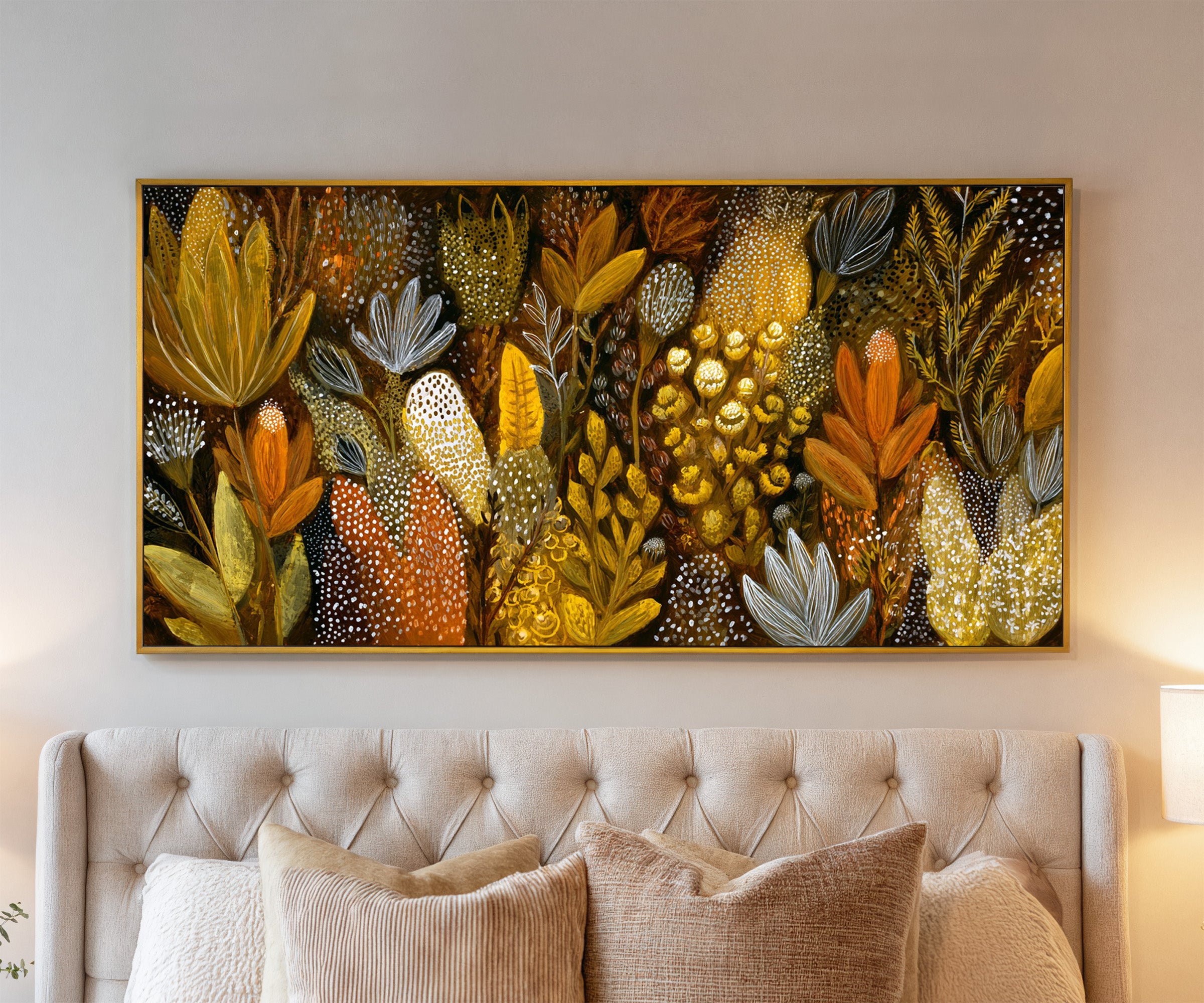 dense ochre and terracotta botanical abstract canvas wall art in a gold frame above a bed