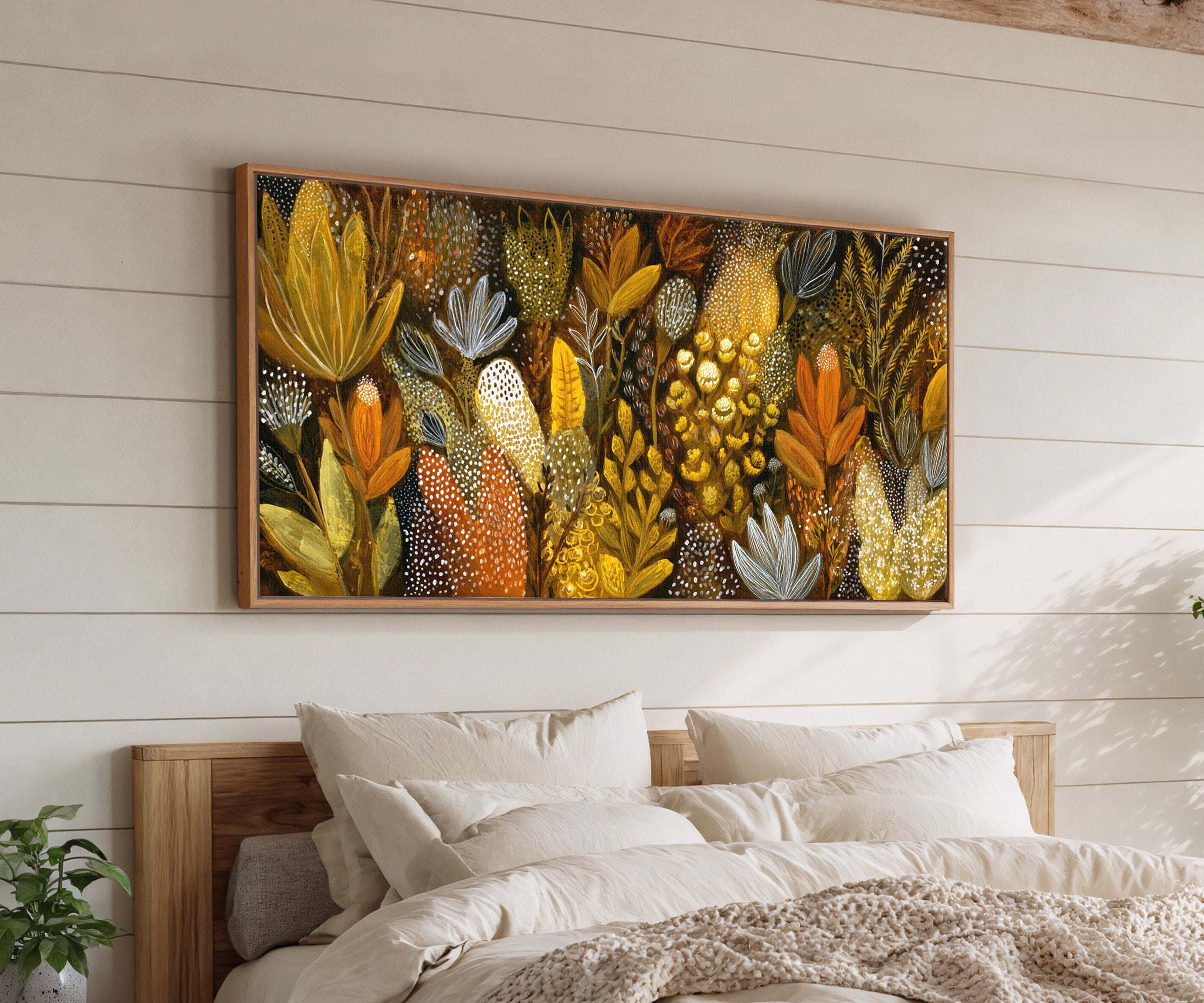 dense ochre and terracotta botanical abstract canvas wall art in an oak frame above a bed