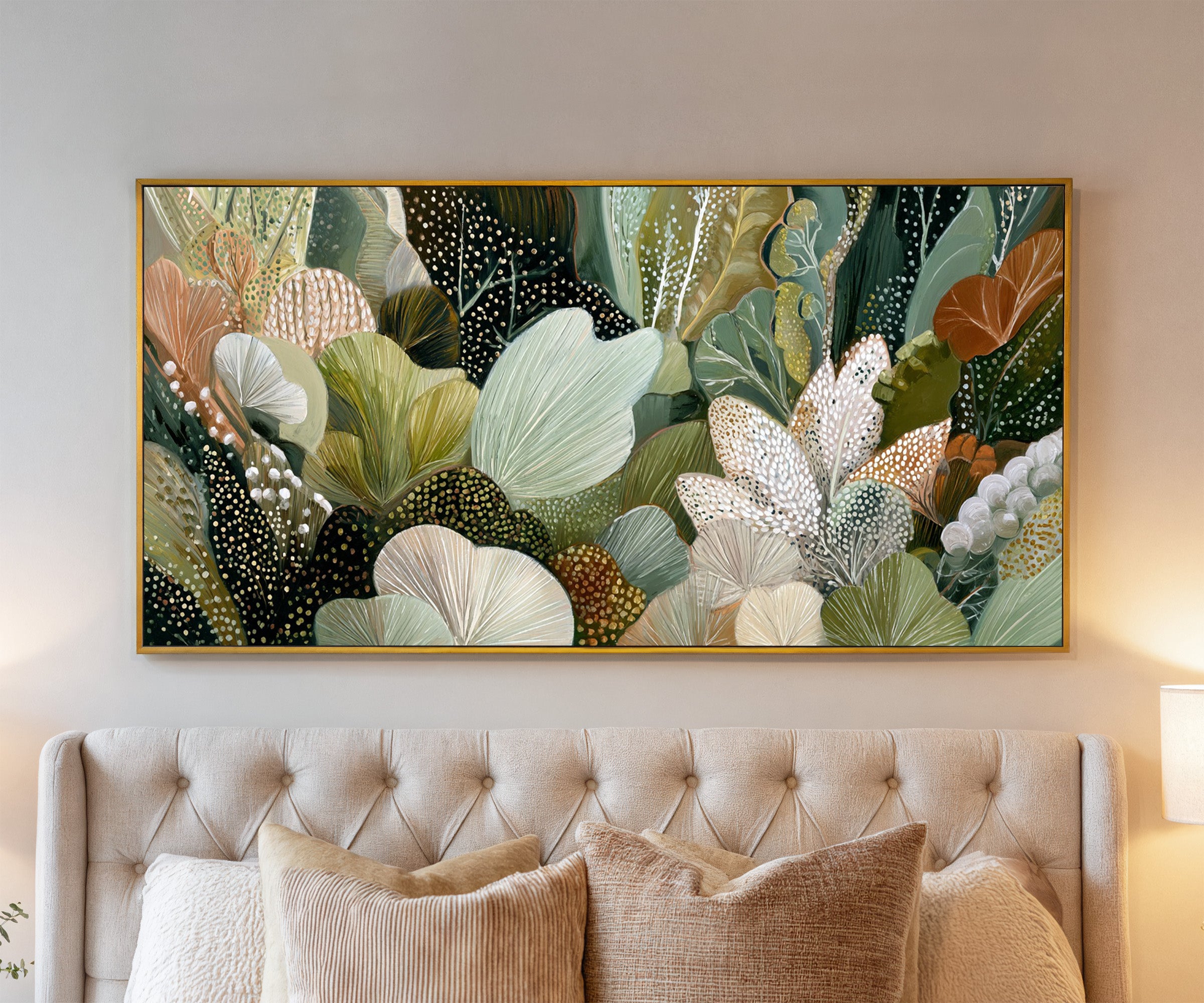 dense forest inspired botanical abstract in canvas wall art in a gold frame above a bed