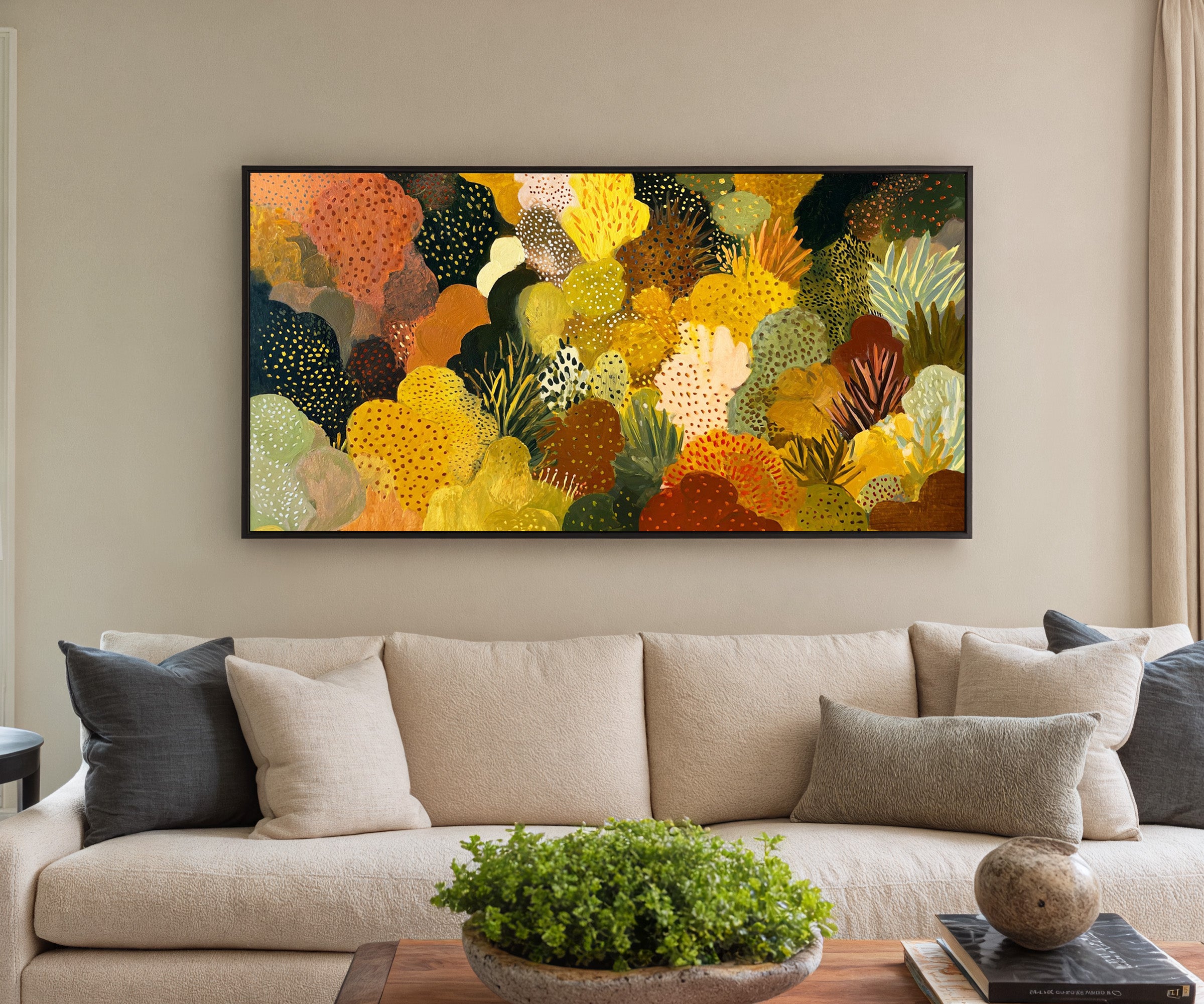 dense ochre and terracotta abstract canvas wall art in a black frame in a styled room setting