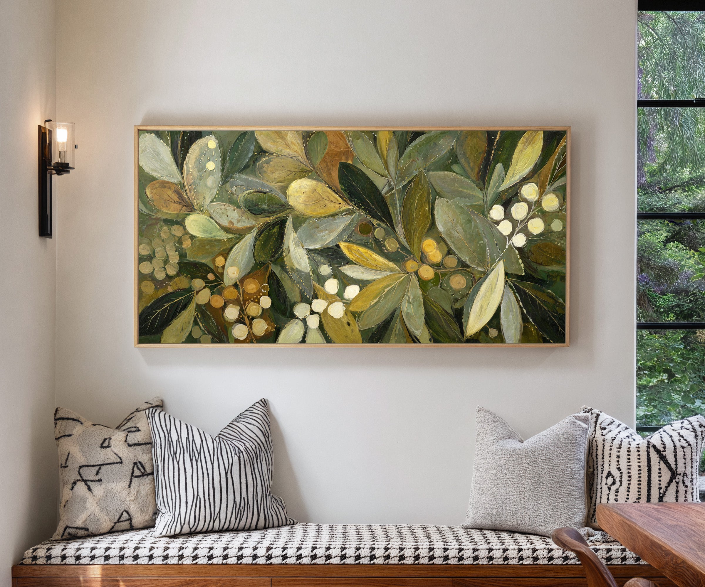 layered olive leaves with pale berries canvas wall art in a natural wood frame in a living room