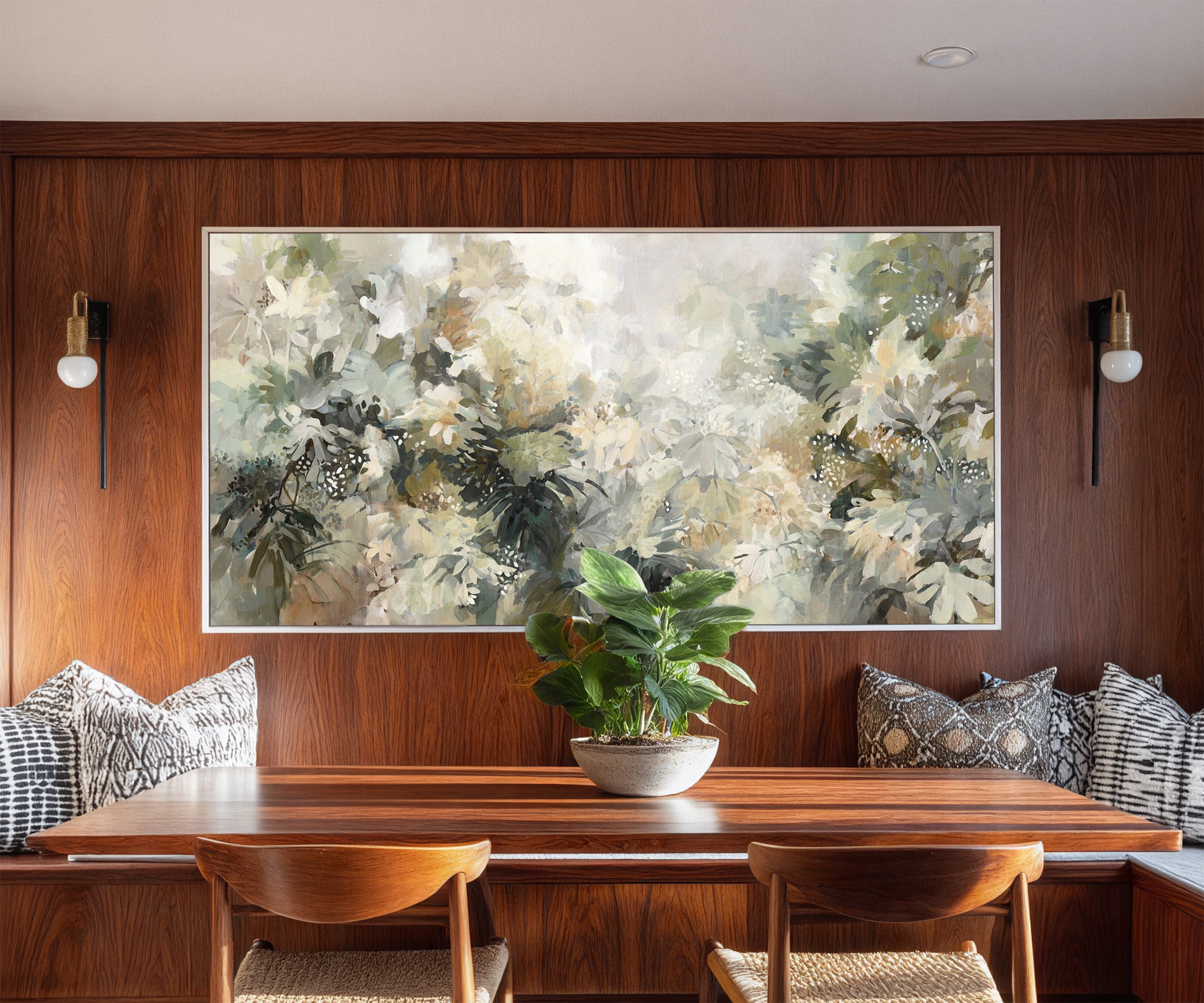 soft layered foliage in cream, sage, olive, and canvas wall art in a white frame in a styled room setting
