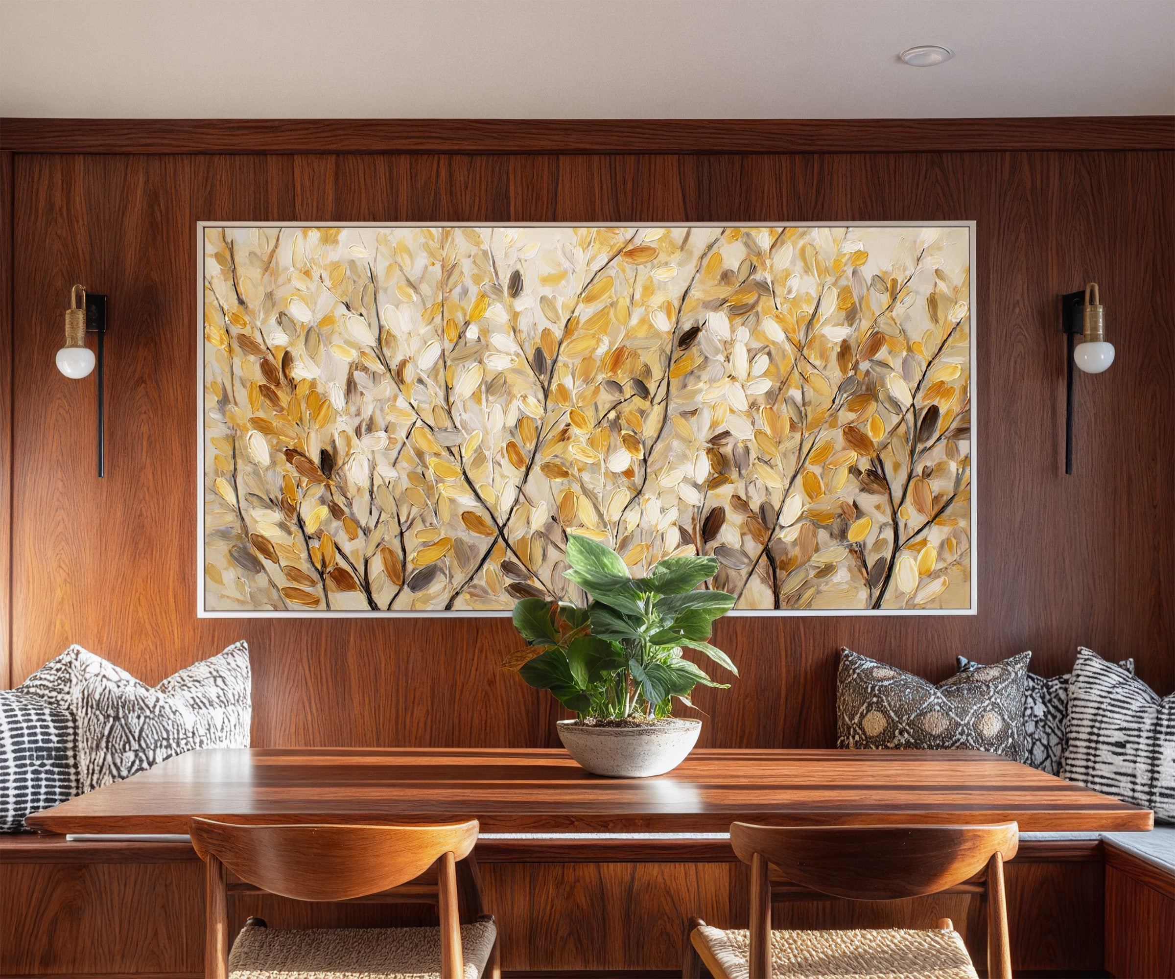 golden leaves and dark branching stems canvas wall art in a white frame in a styled room setting