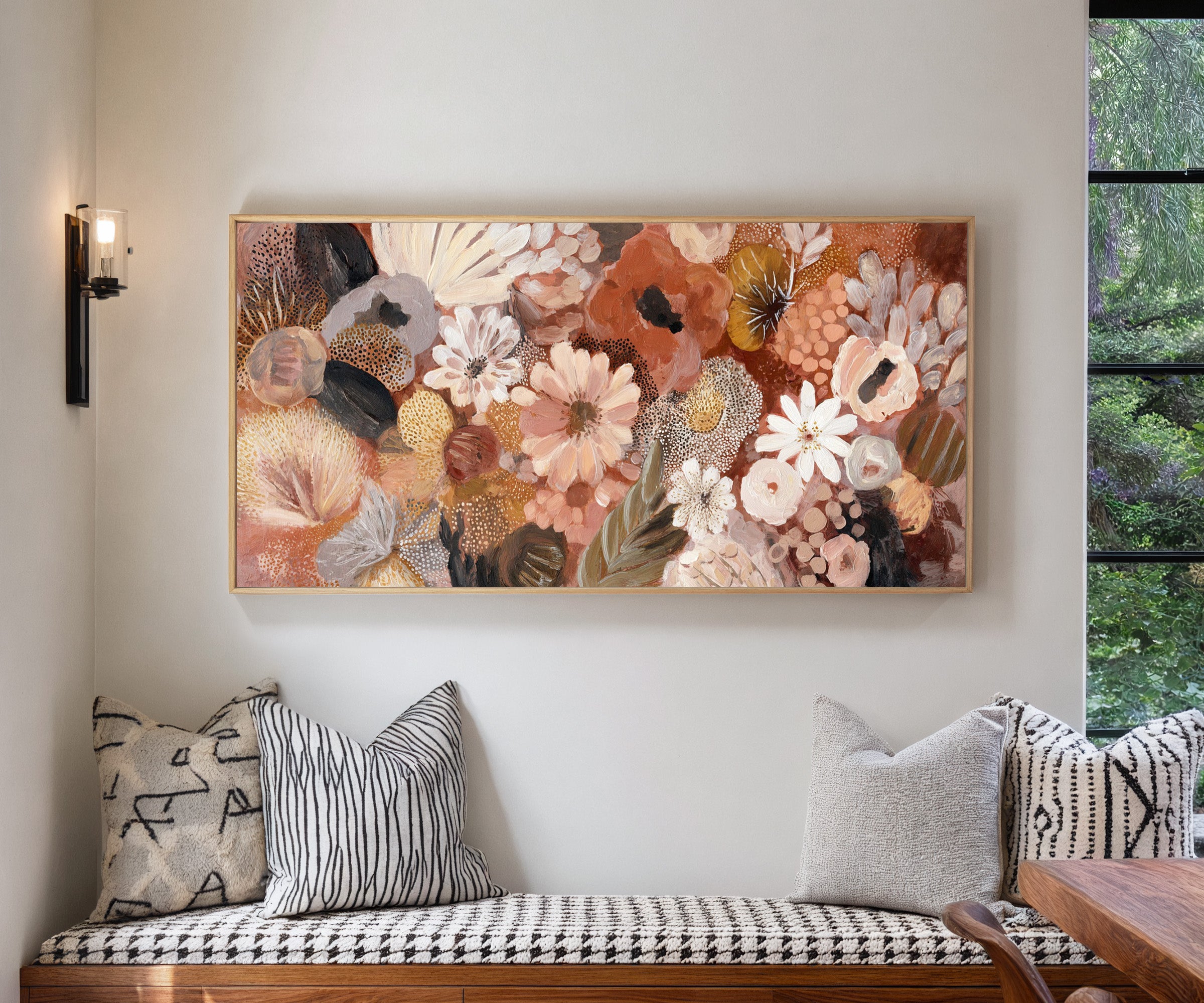 densely packed rounded florals in terracotta, canvas wall art in a natural wood frame in a living room