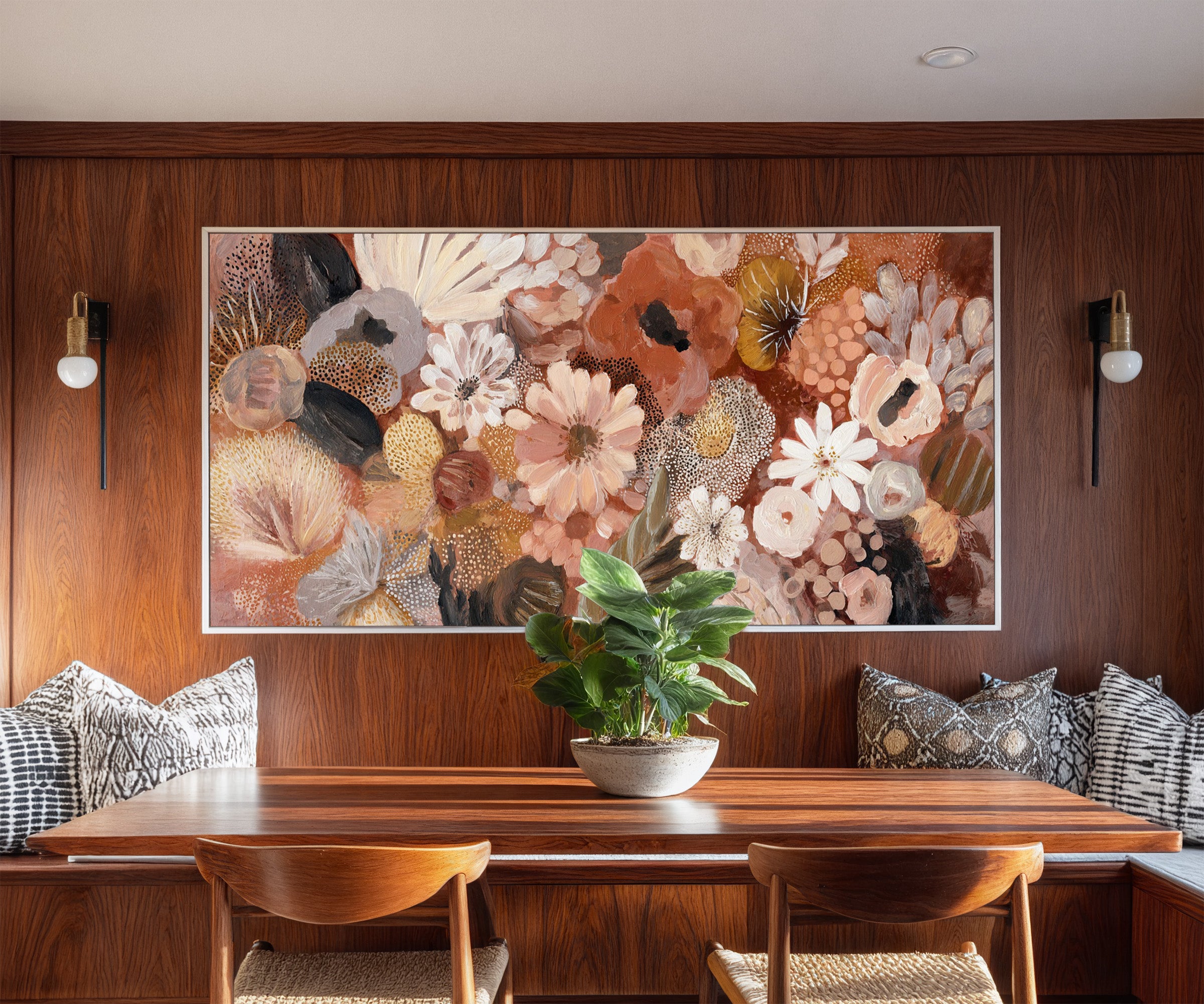 densely packed rounded florals in terracotta, canvas wall art in a white frame in a styled room setting