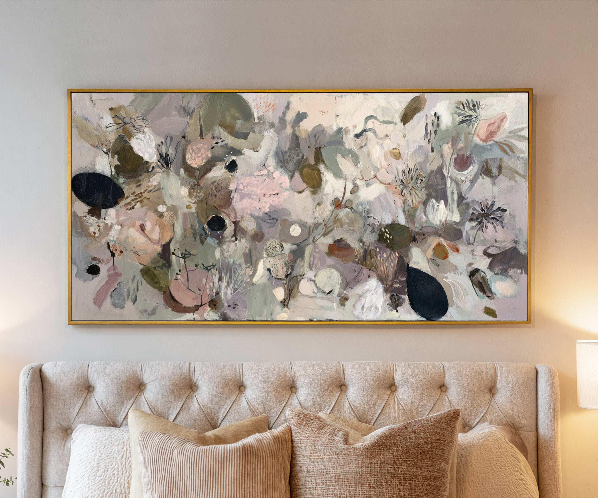neutral abstract with moss green, taupe, beige, canvas wall art in a gold frame above a bed