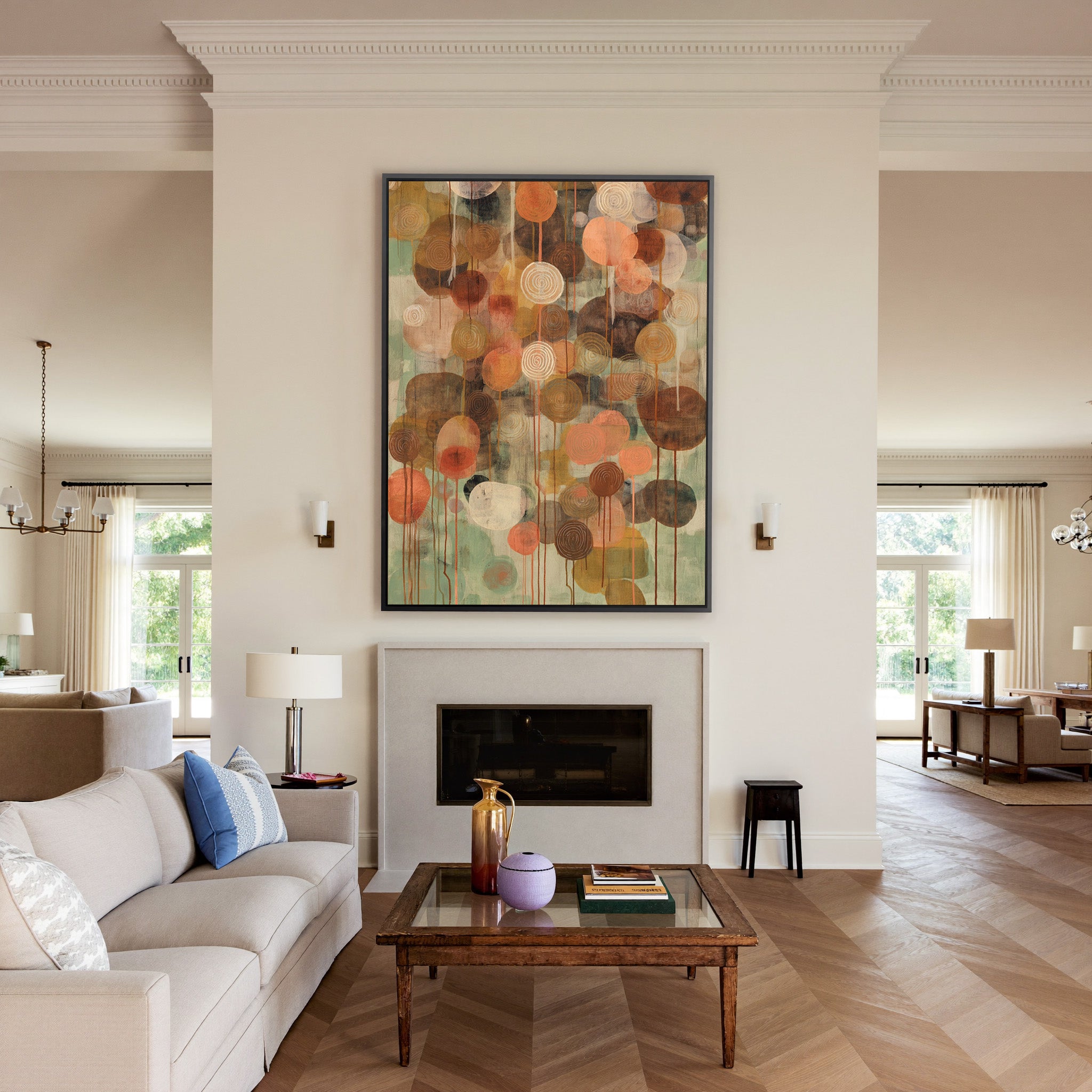soft green and warm earth abstract with canvas wall art in a black frame above a mantel