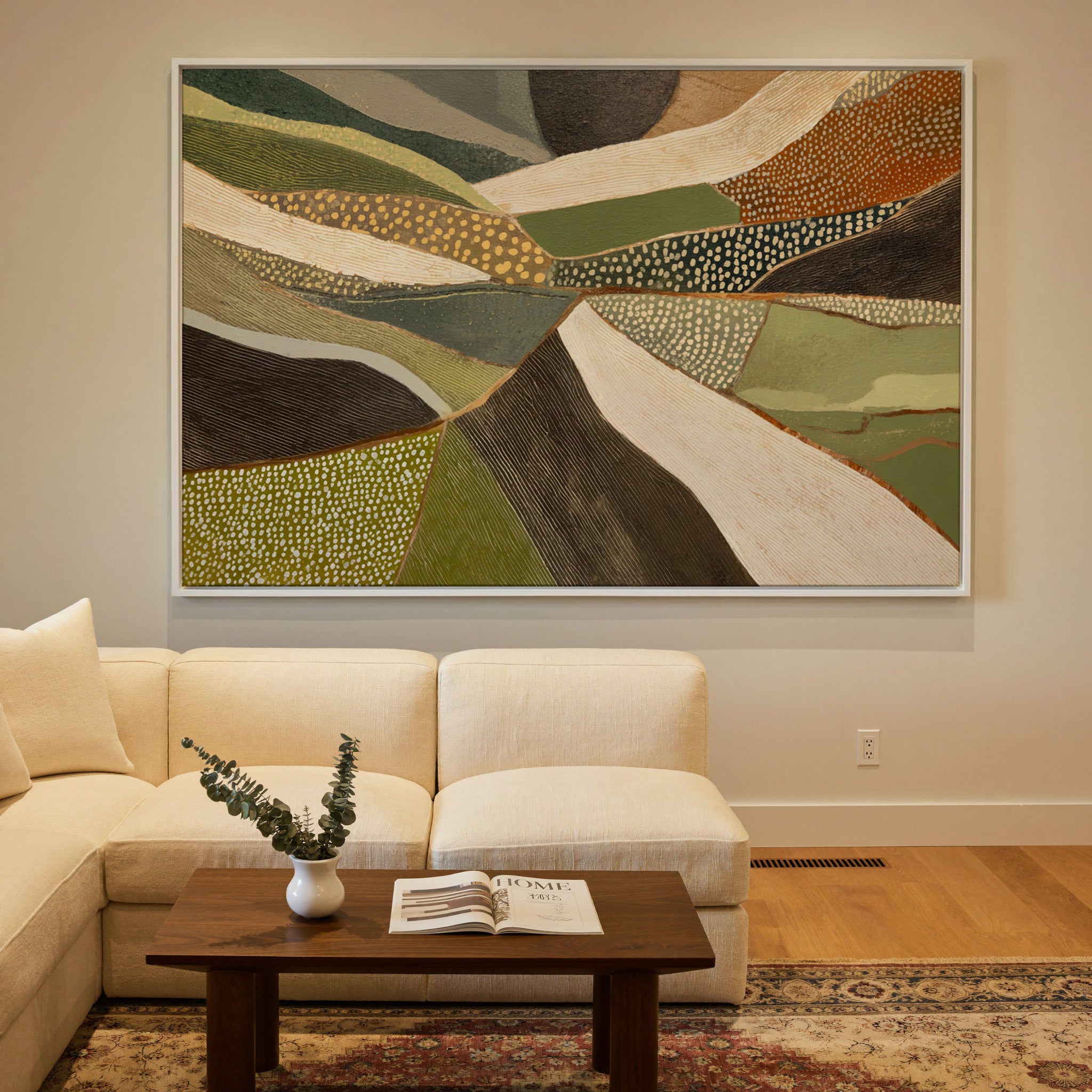 layered olive, cream, and brown abstract with canvas wall art in a white frame in a styled room setting