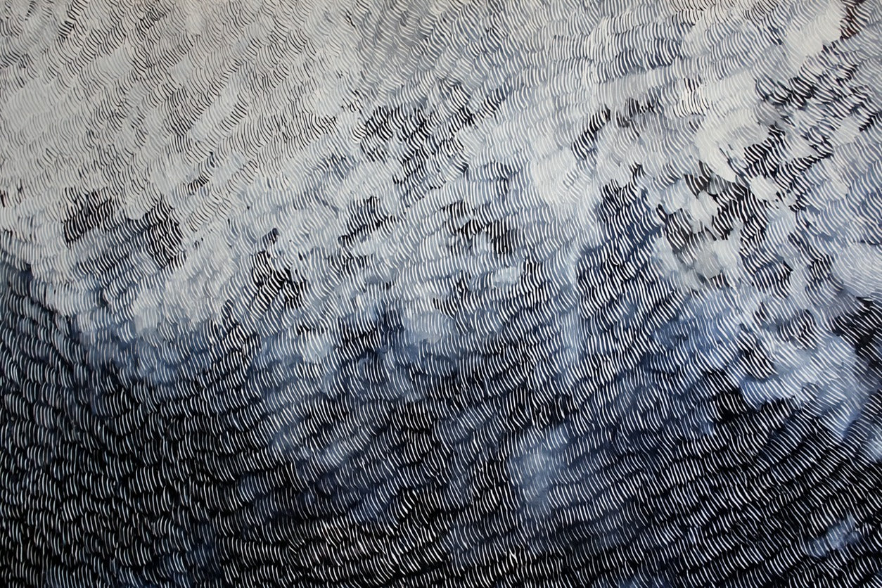 Dense curved black marks over white and gray layers, with smoky light areas and dark edges