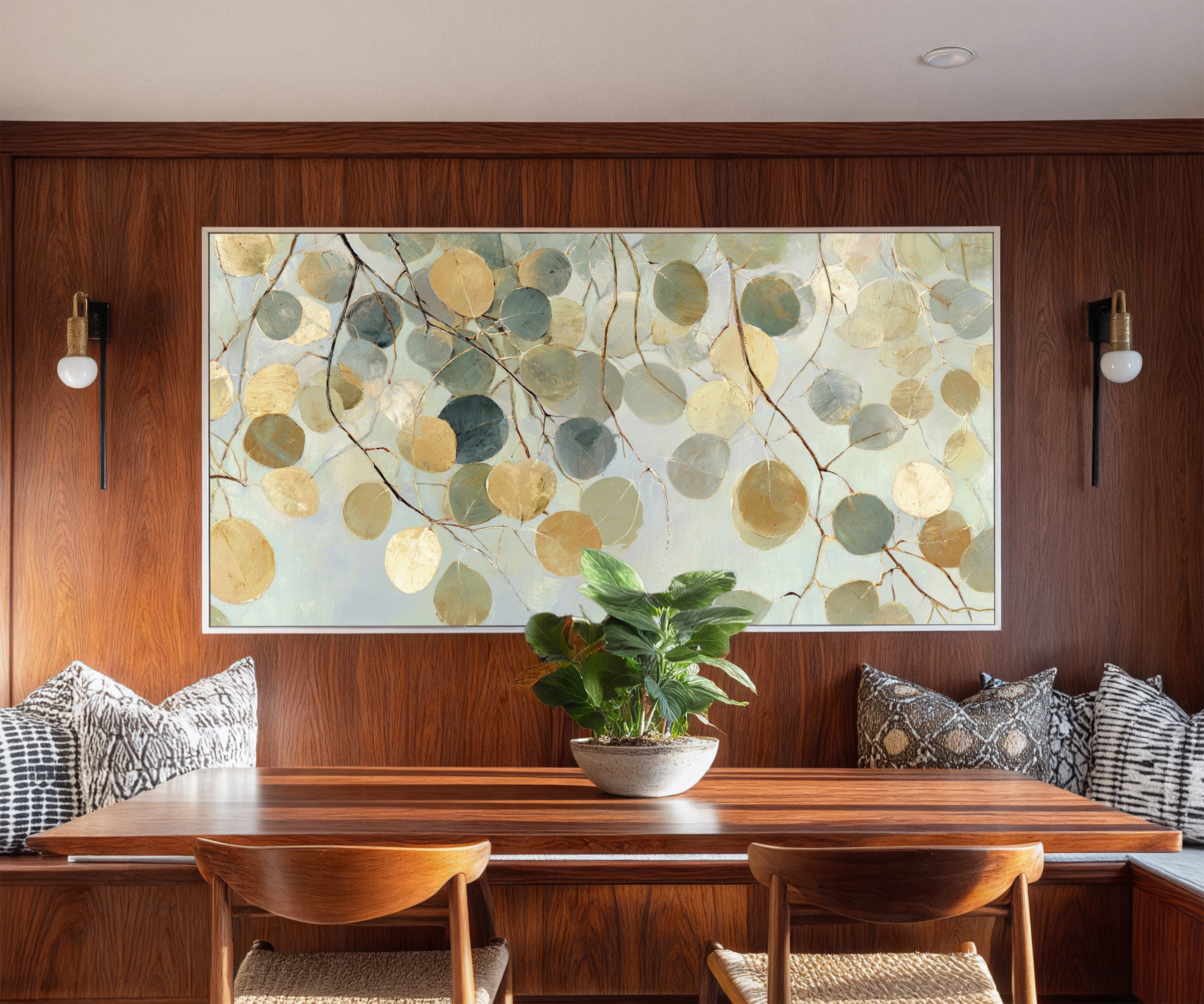 pale round leaves on branching stems canvas wall art in a white frame in a styled room setting