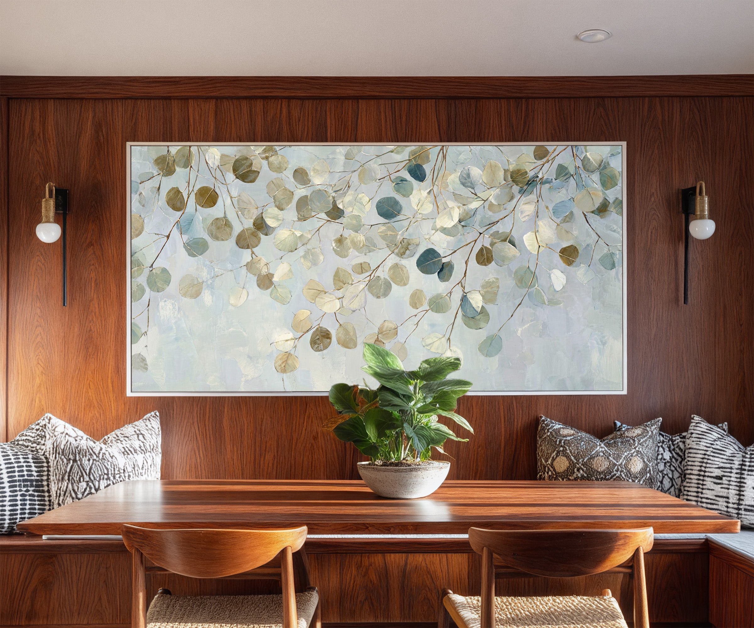 pale eucalyptus leaves on thin branching stems canvas wall art in a white frame in a styled room setting