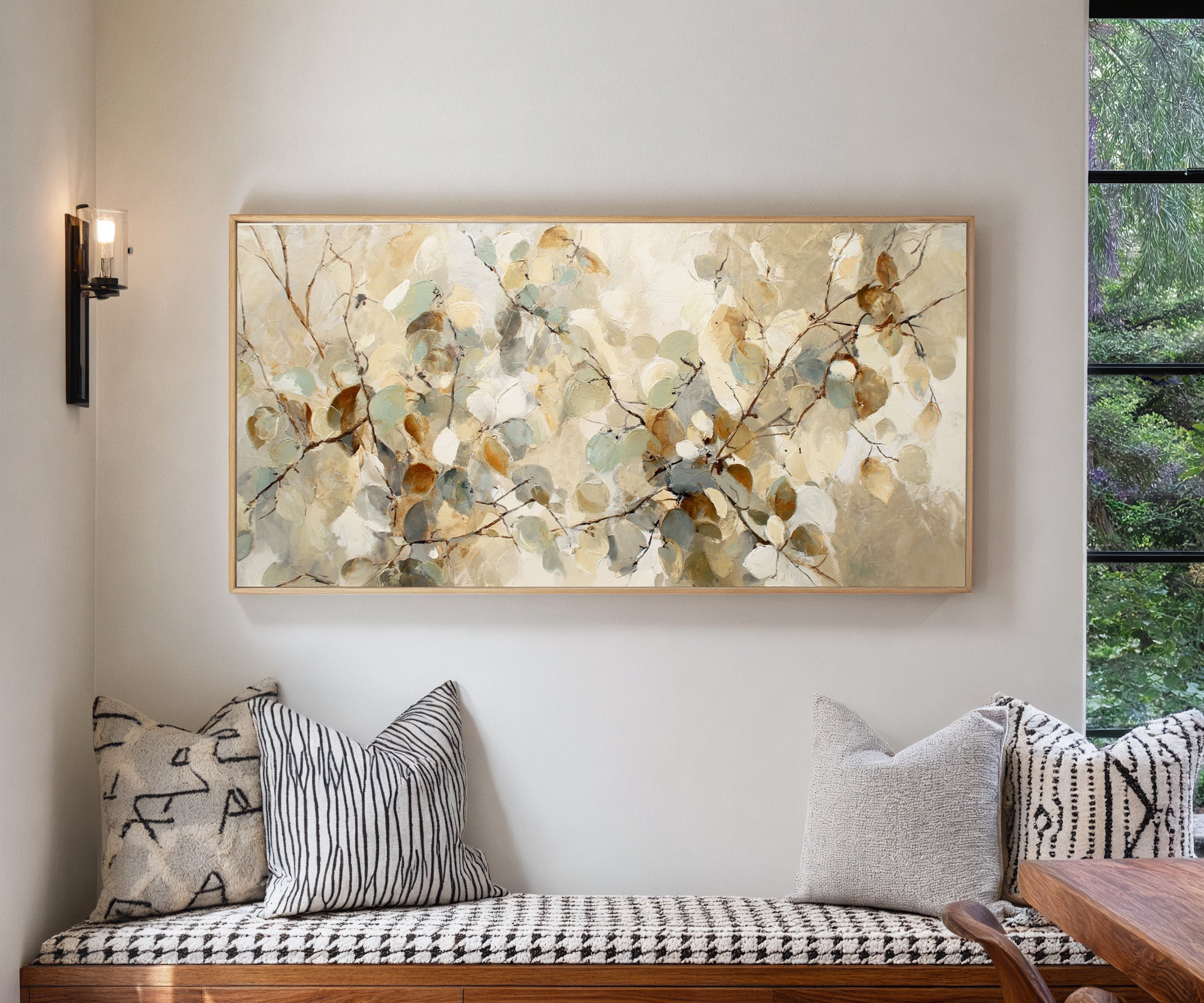 soft eucalyptus leaves in cream, sage, blue canvas wall art in a natural wood frame in a living room