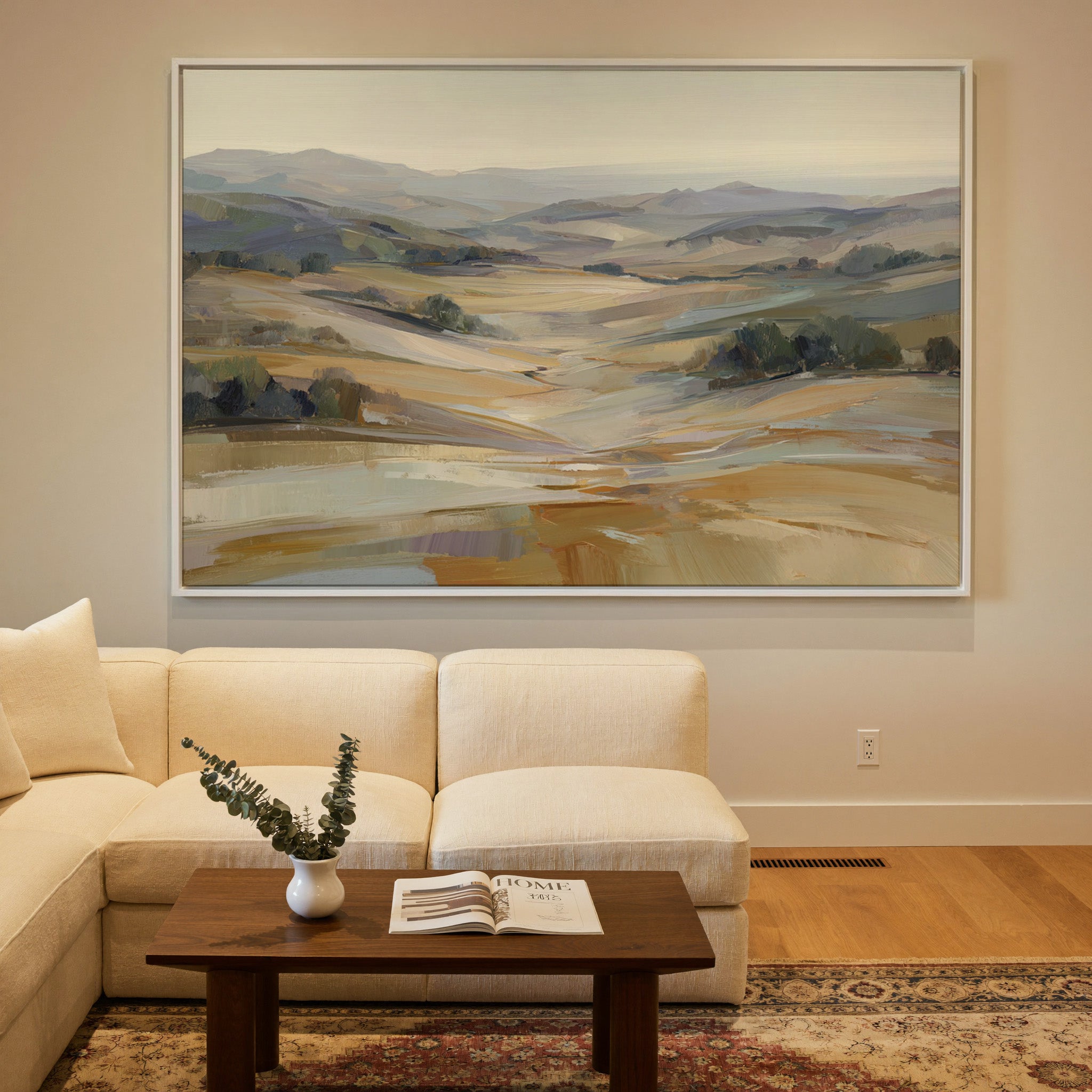 pale rolling hills and valley in cream, gold, canvas wall art in a white frame in a styled room setting