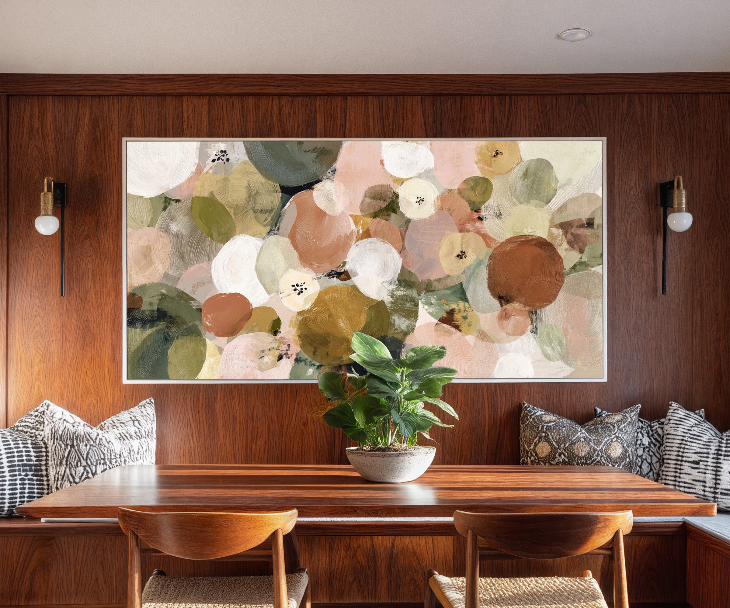 muted olive, blush, cream, and gold circles canvas wall art in a white frame in a styled room setting