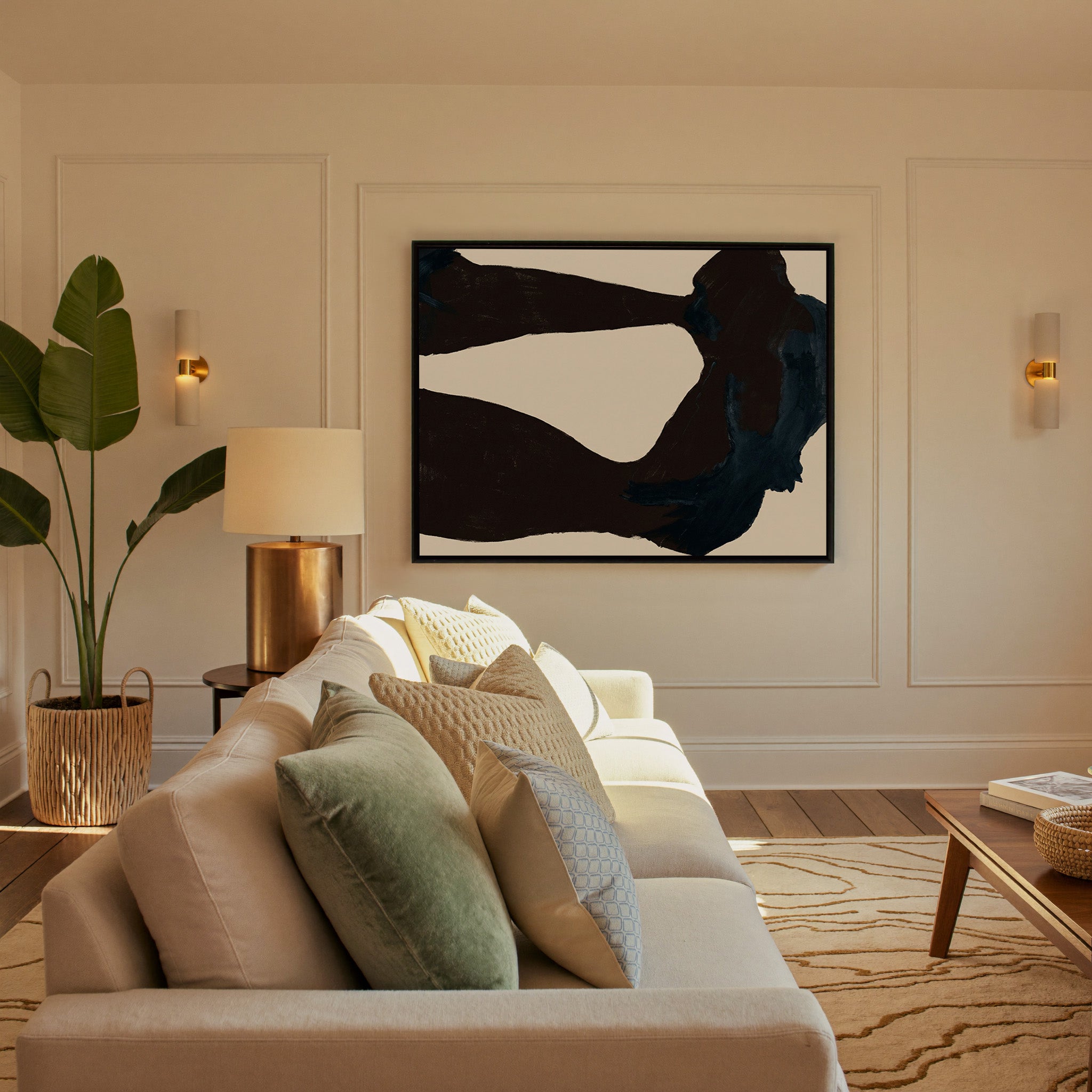 dark charcoal and deep blue abstract with broad canvas wall art in a black frame in a styled room setting