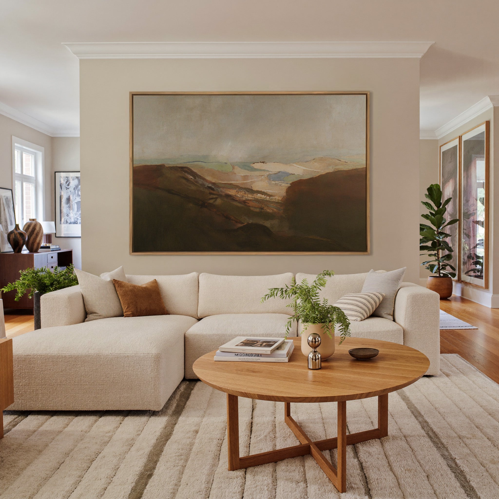 soft desert landscape with layered dunes and a canvas wall art in an oak frame in a living room