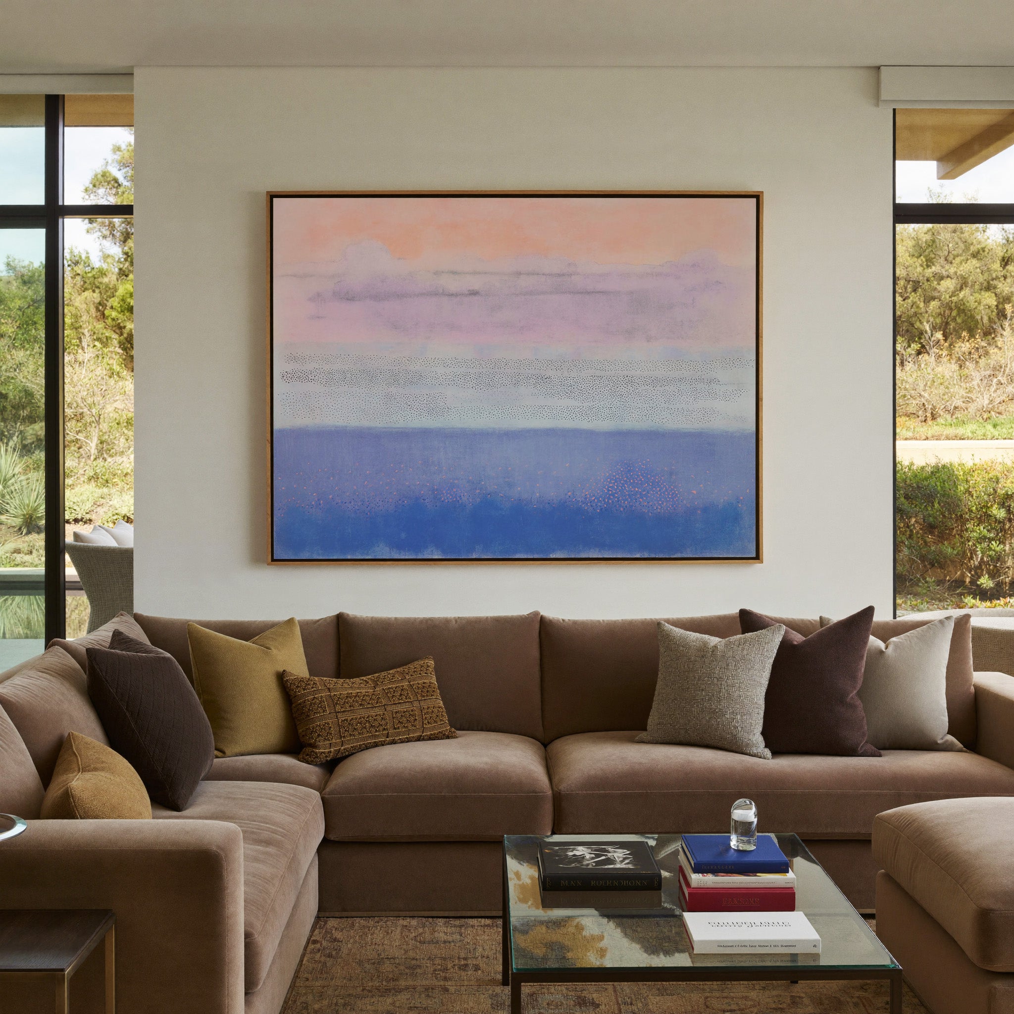 soft peach, lavender, and blue abstract canvas wall art in an oak frame in a styled room setting