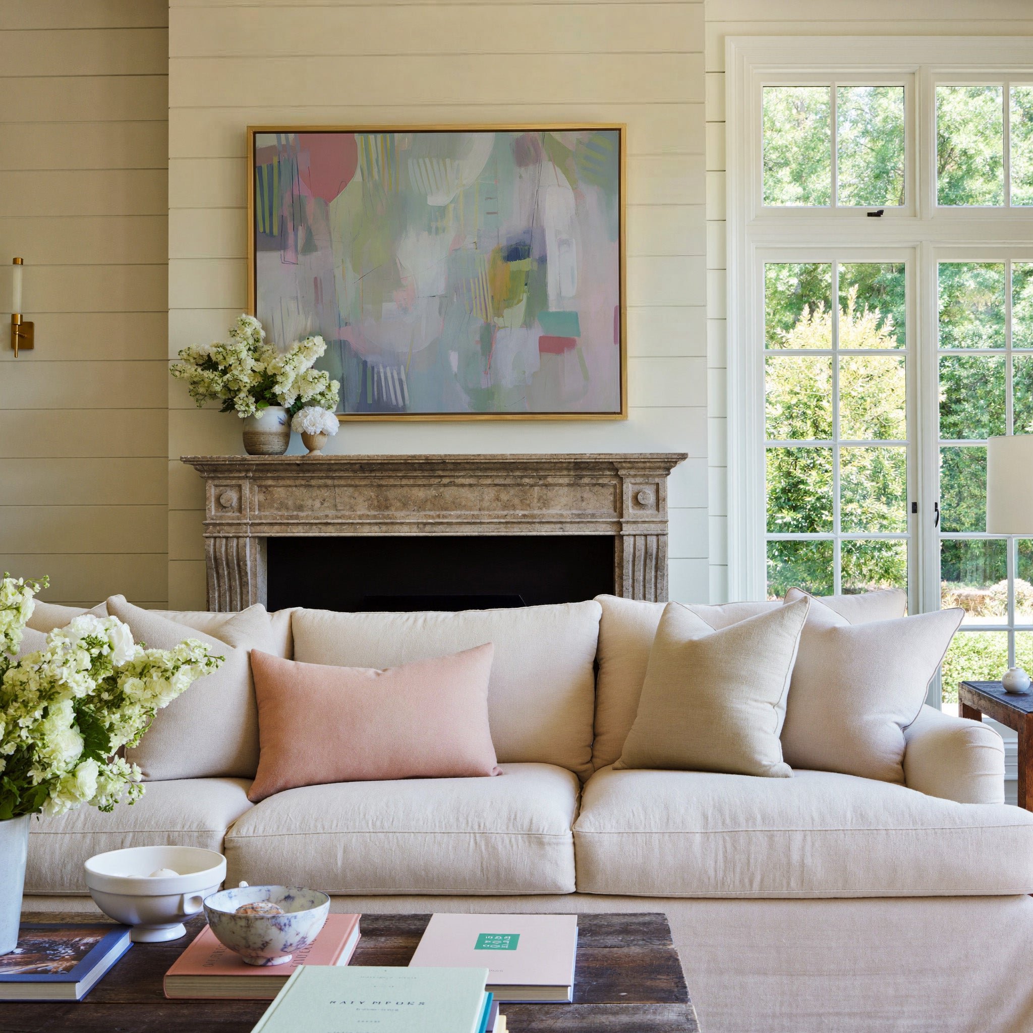 pastel abstract with vertical marks canvas wall art in a gold frame above a mantel