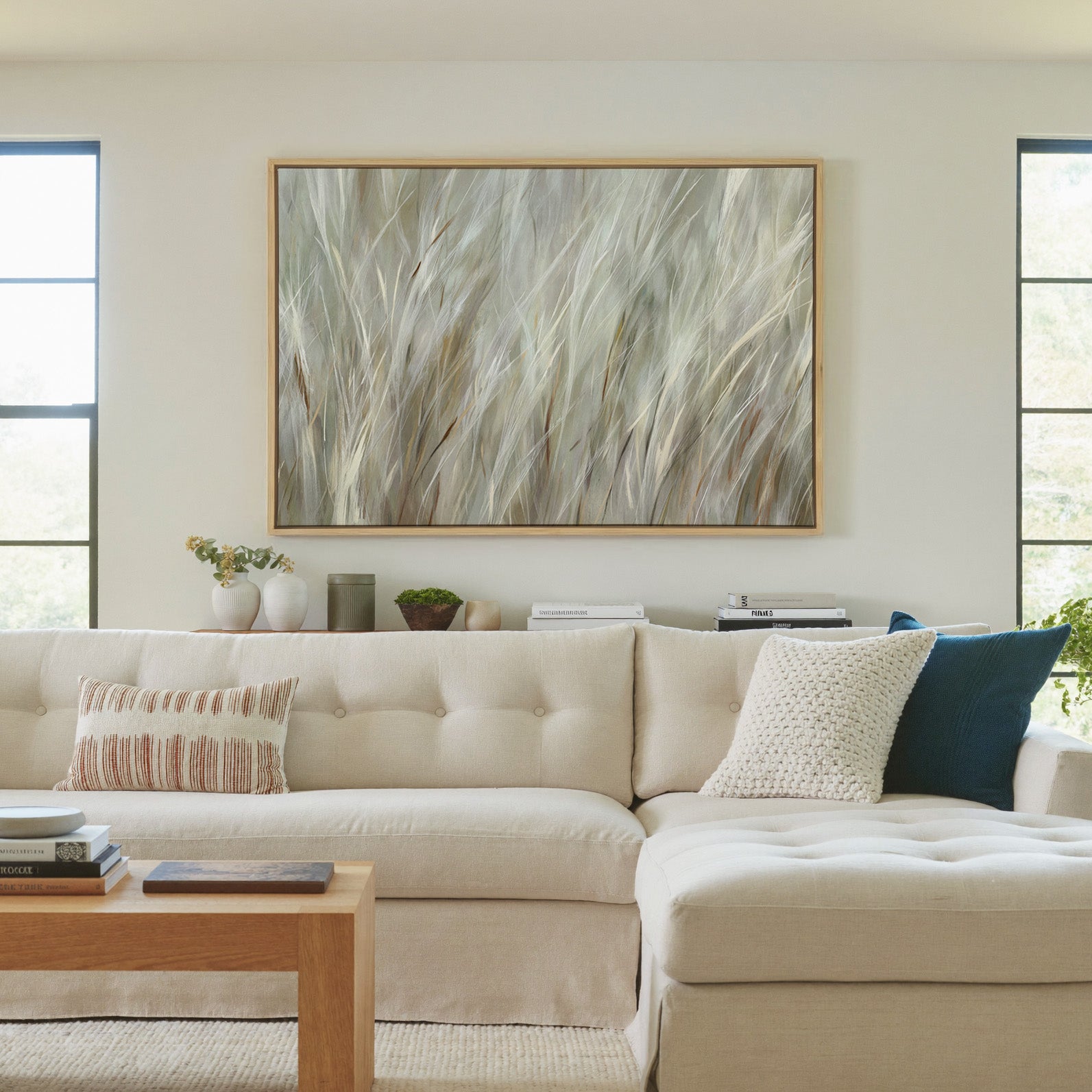soft beige and cream grass blades canvas wall art in a natural wood frame in a living room