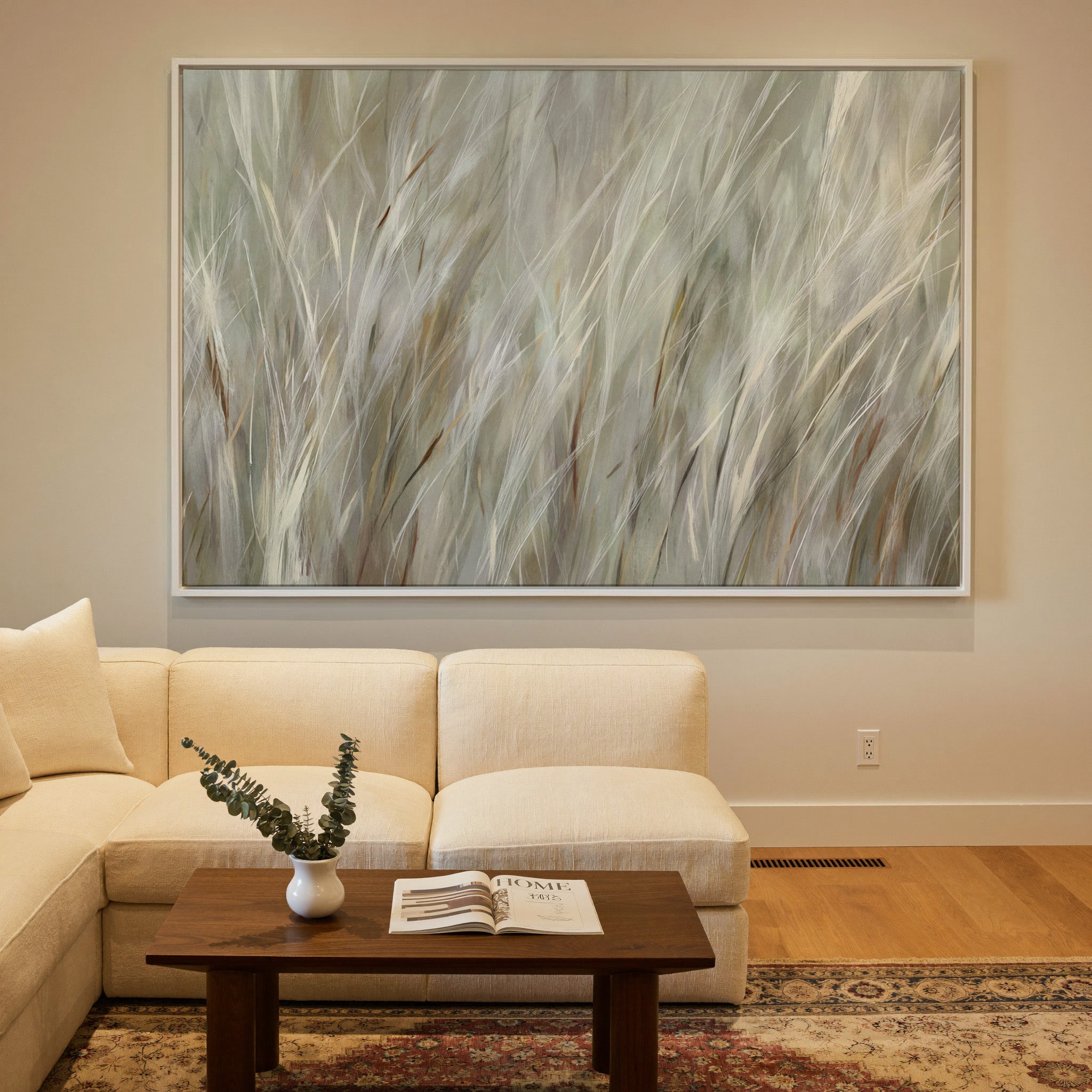 soft beige and cream grass blades canvas wall art in a white frame in a styled room setting