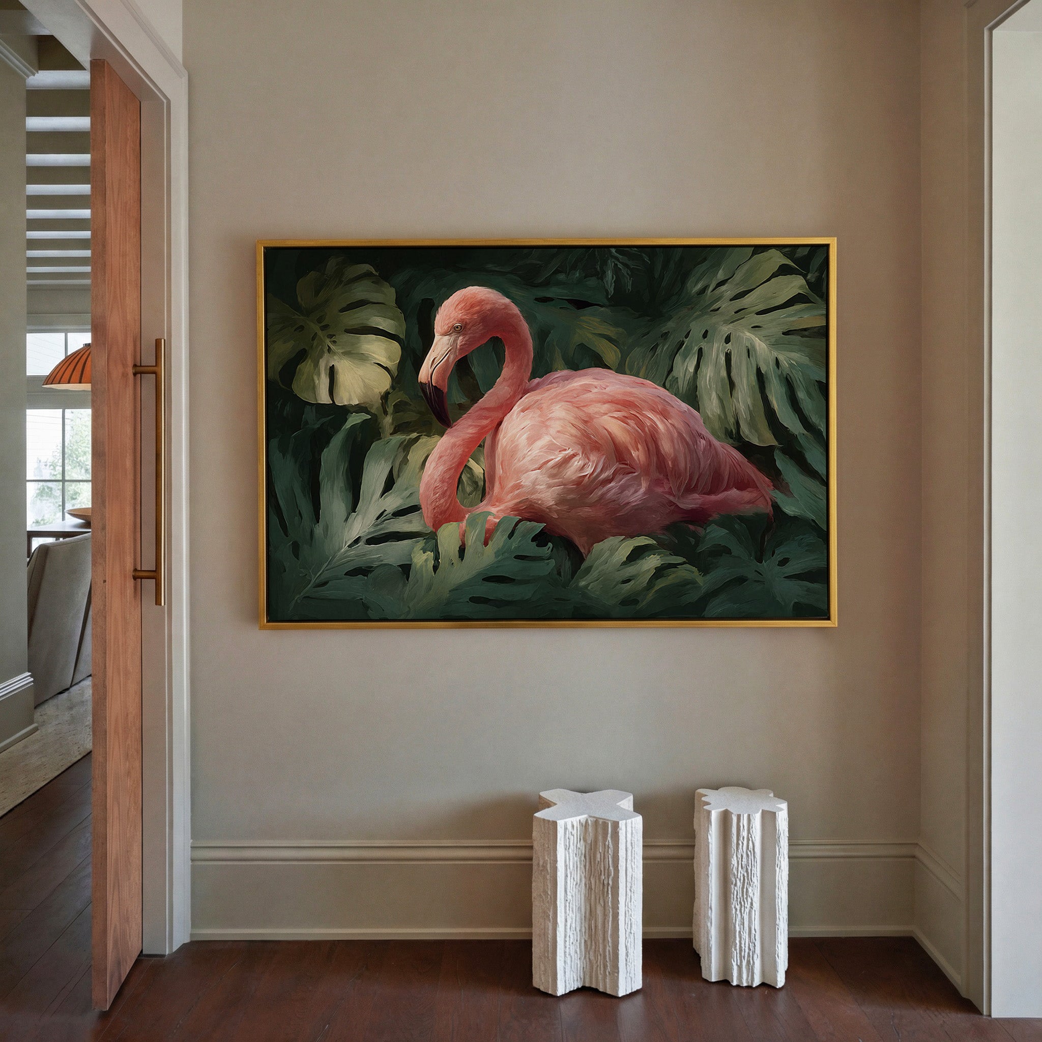 pink flamingo among dark green leaves canvas wall art in a gold frame in a styled room setting