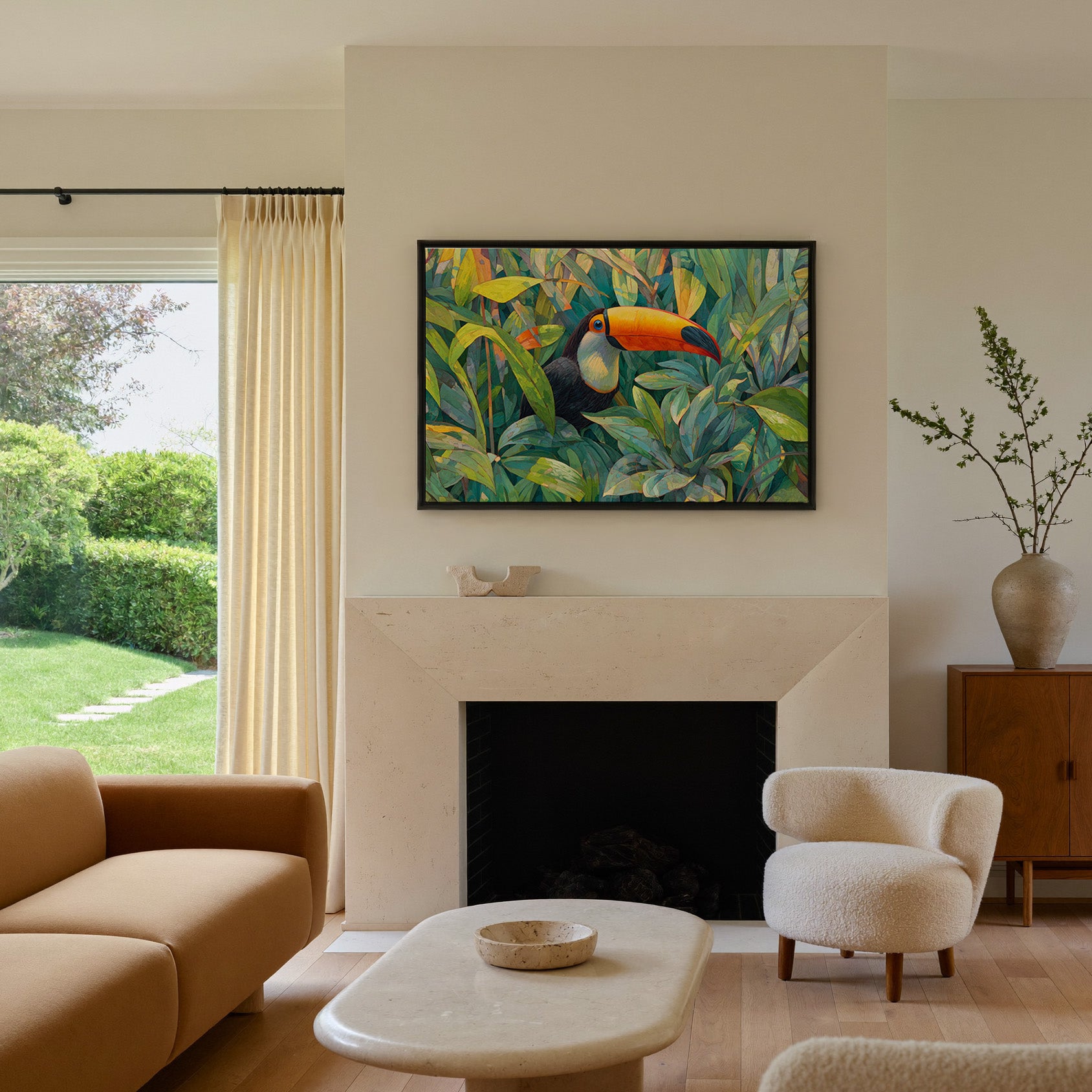 toucan in dense tropical foliage canvas wall art in a black frame above a mantel