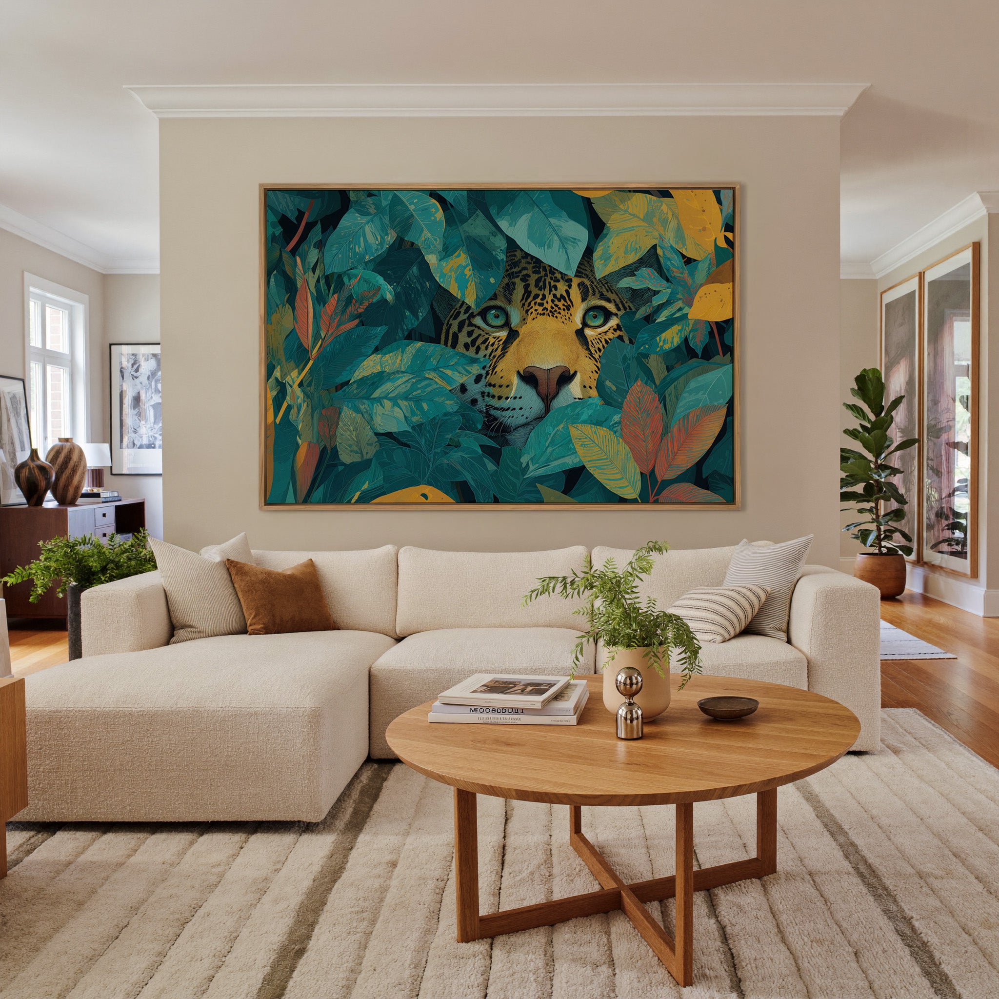leopard face framed by teal leaves and gold canvas wall art in an oak frame in a living room