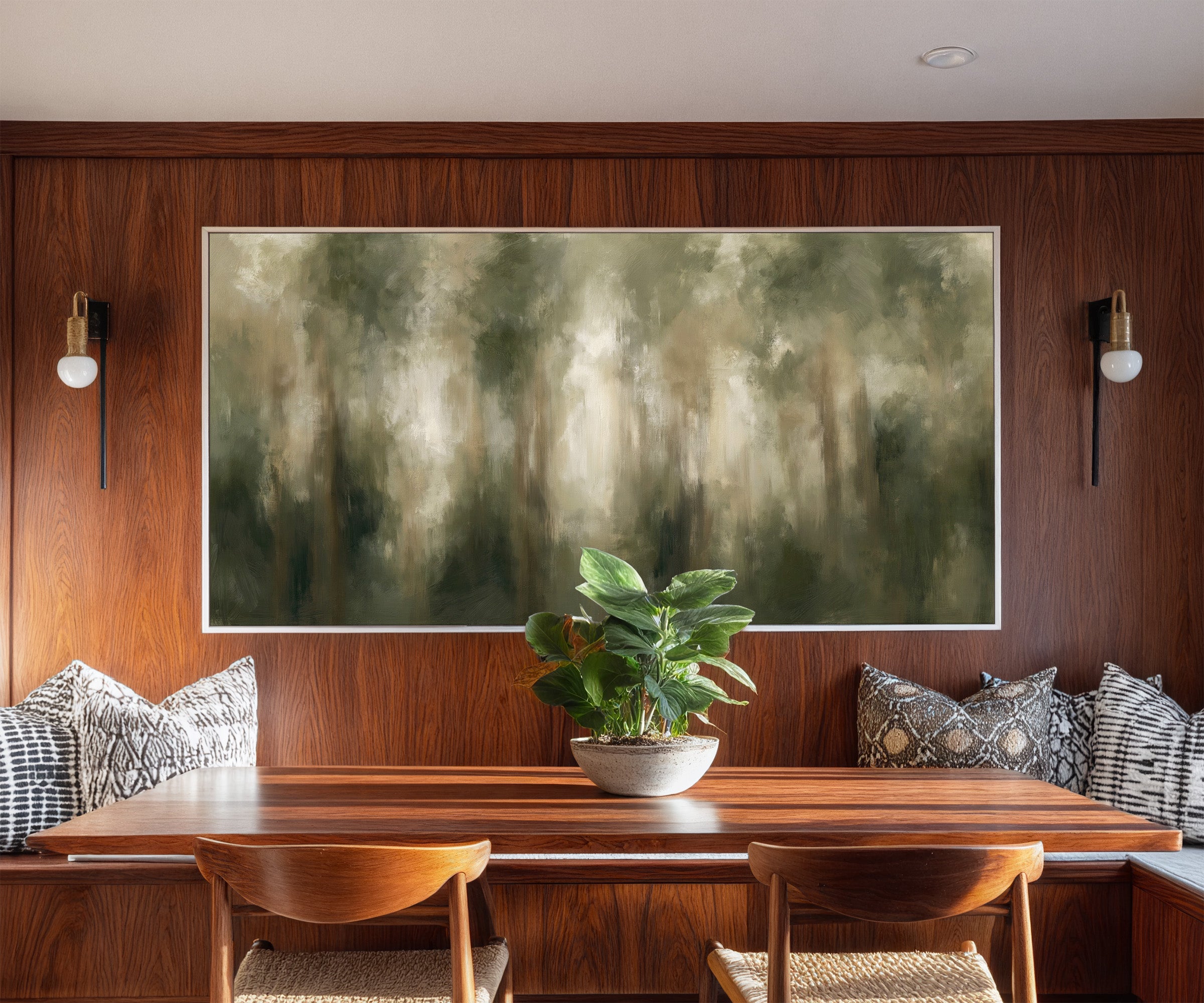 soft green and beige abstract forest canvas wall art in a white frame in a styled room setting