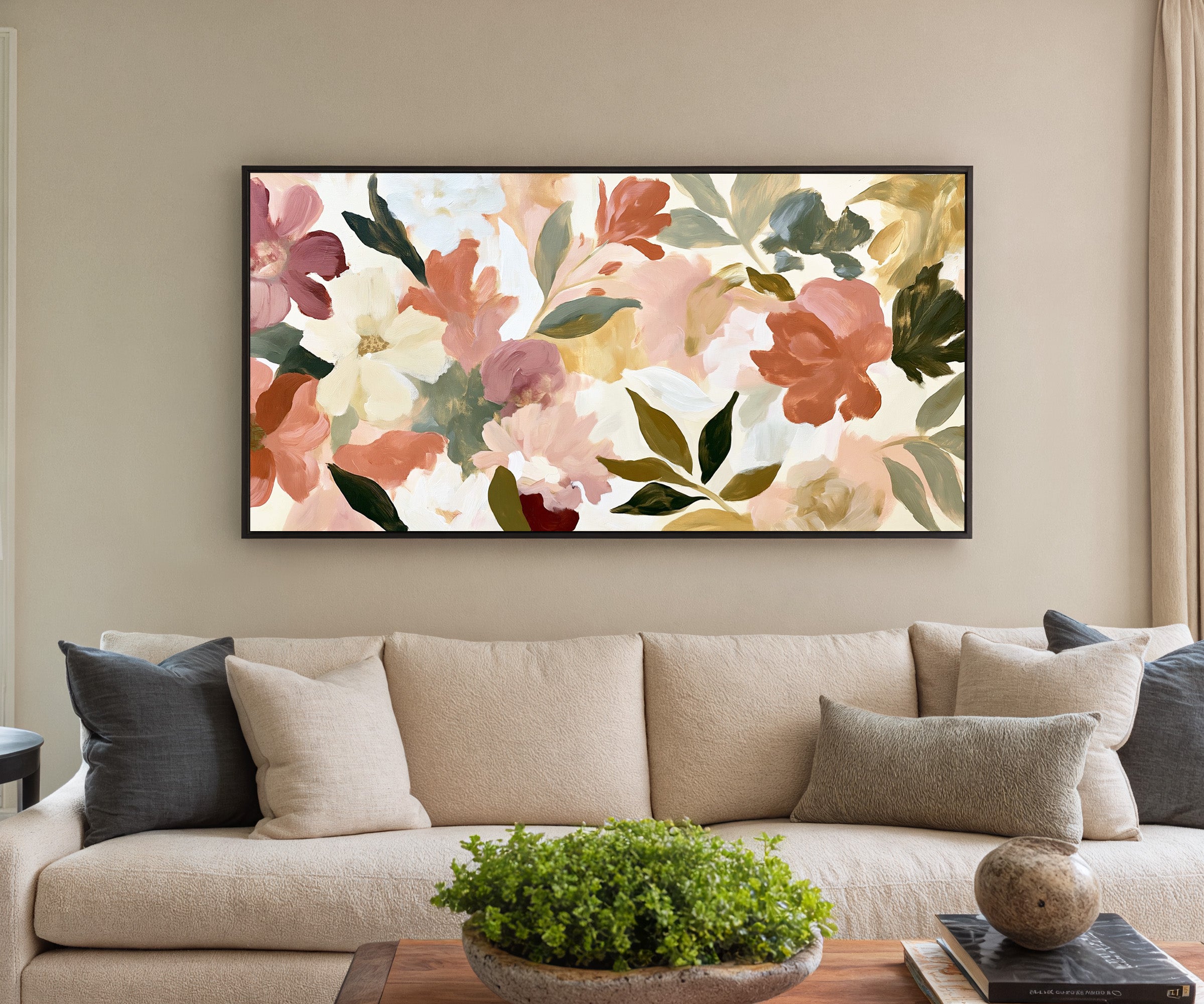soft blush, cream, and terracotta floral forms canvas wall art in a black frame in a styled room setting