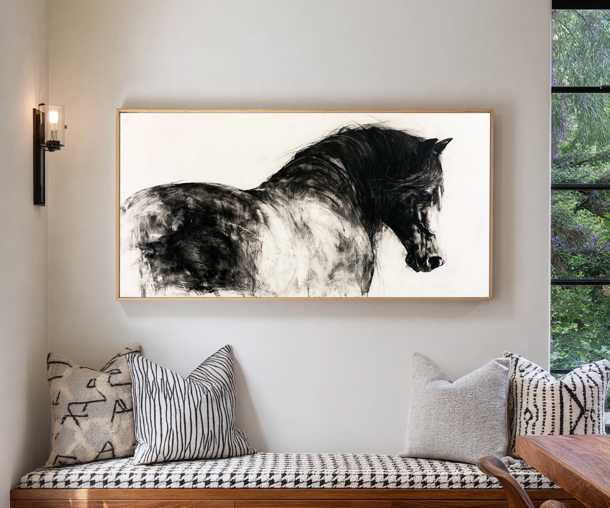 black and white close cropped horse portrait canvas wall art in a natural wood frame in a living room