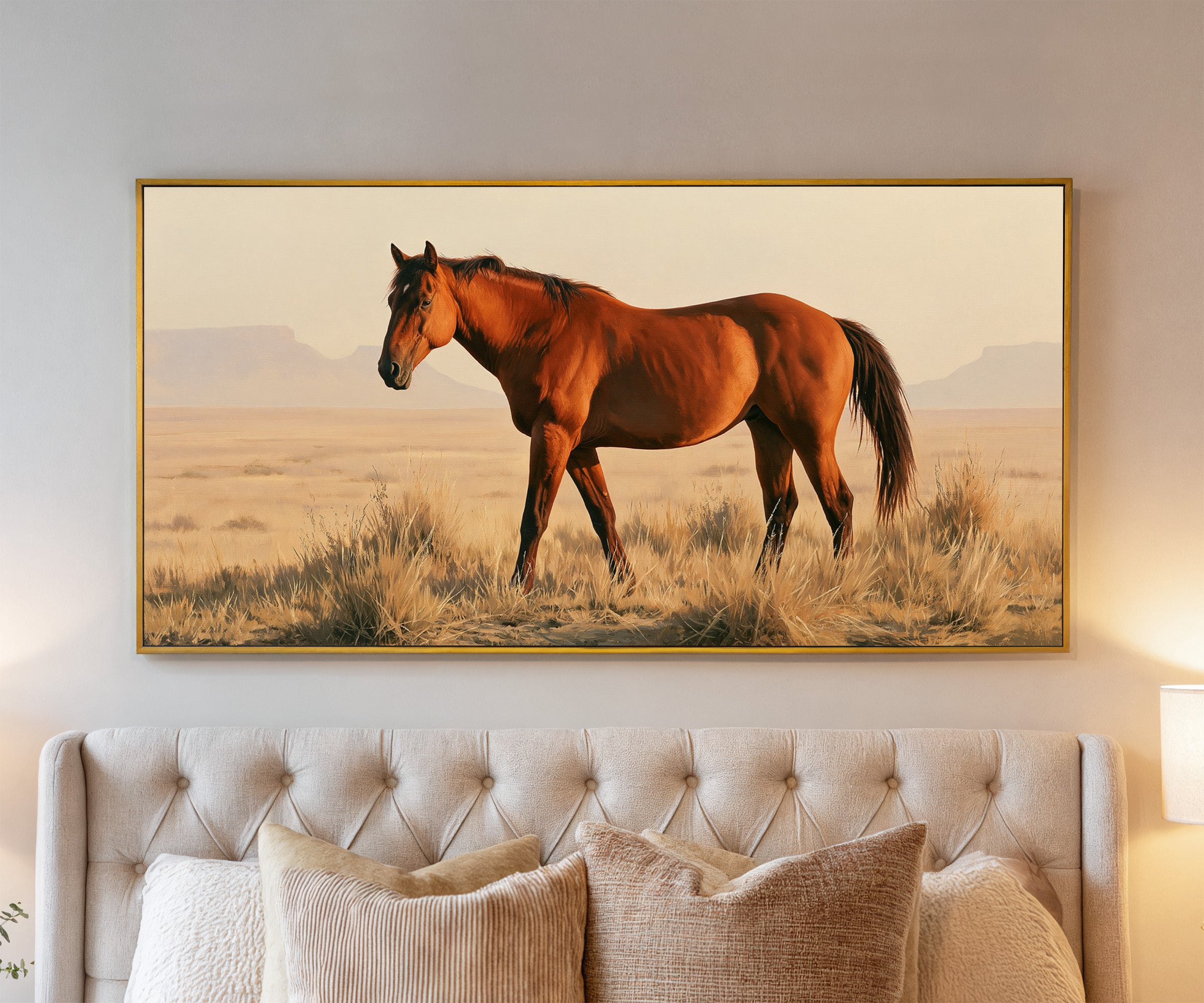 chestnut horse in dry desert grass canvas wall art in a gold frame above a bed