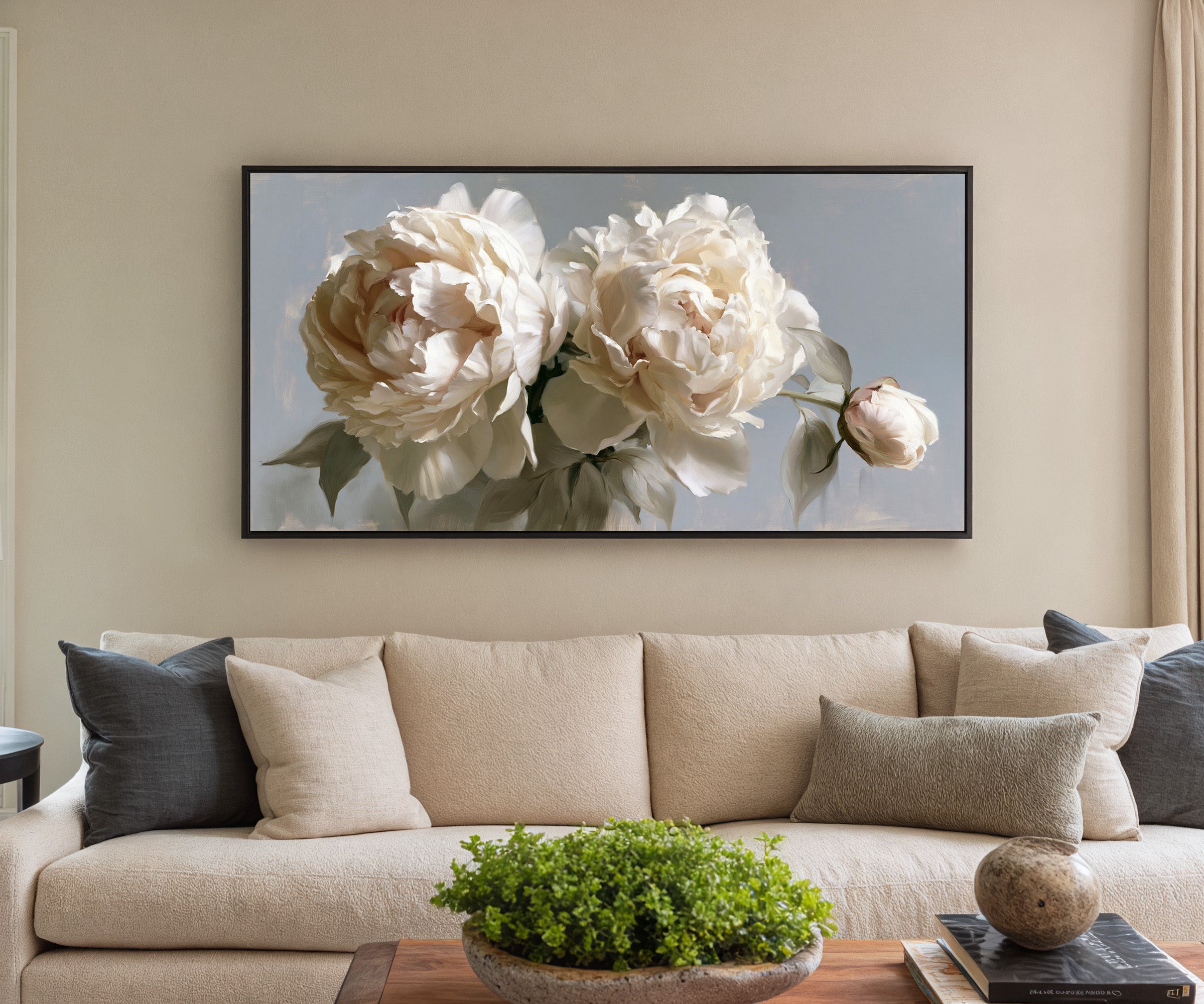cream peonies with a single bud canvas wall art in a black frame in a styled room setting