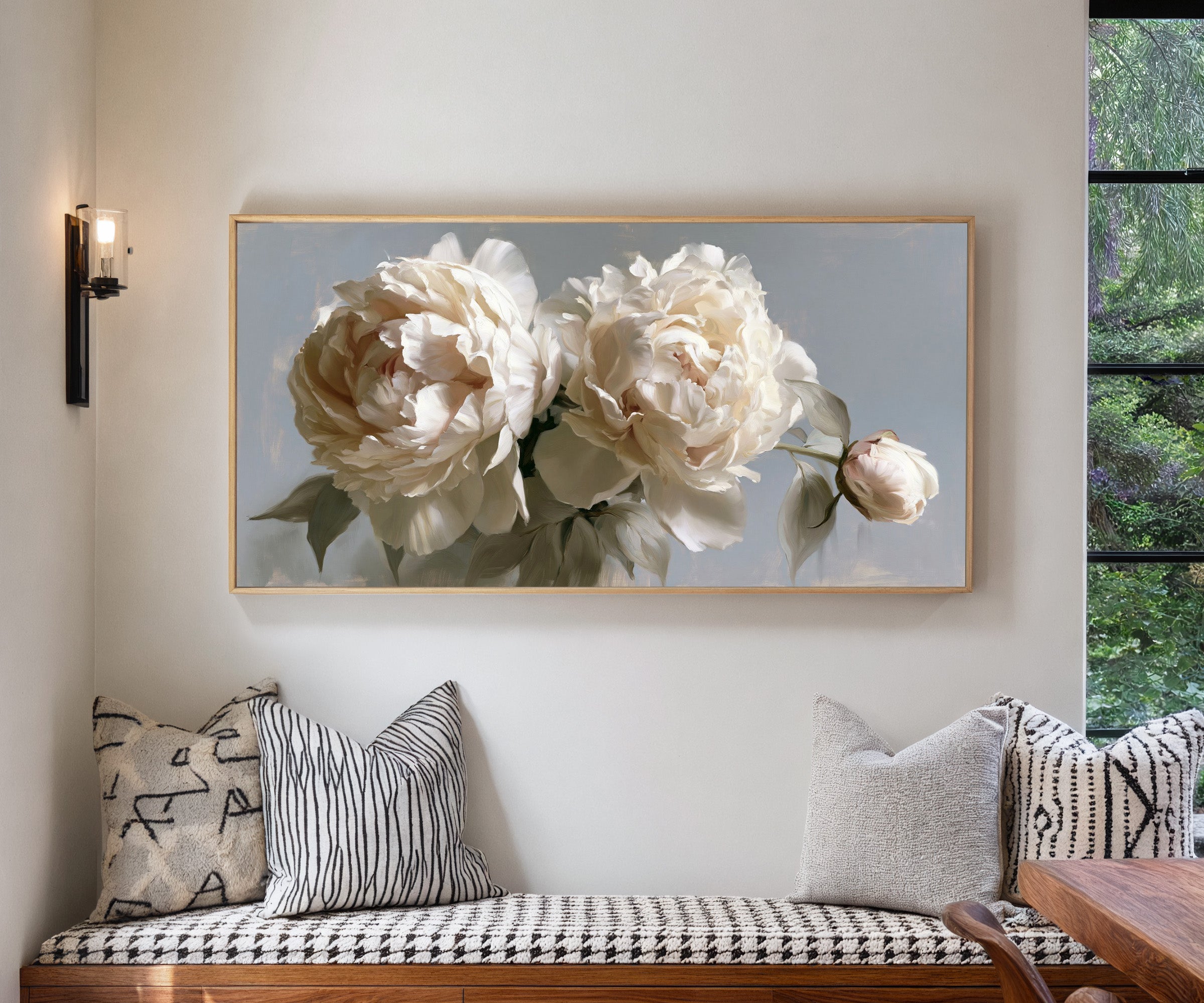 cream peonies with a single bud canvas wall art in a natural wood frame in a living room