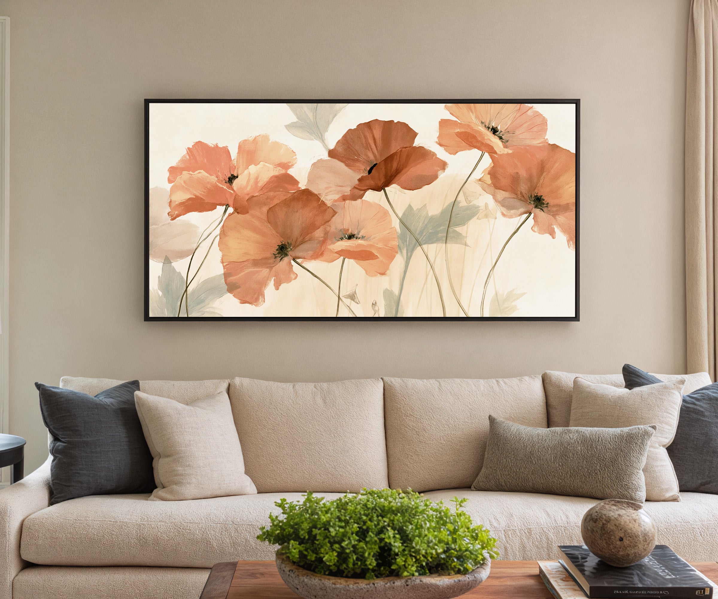 soft coral poppy flowers canvas wall art in a black frame in a styled room setting