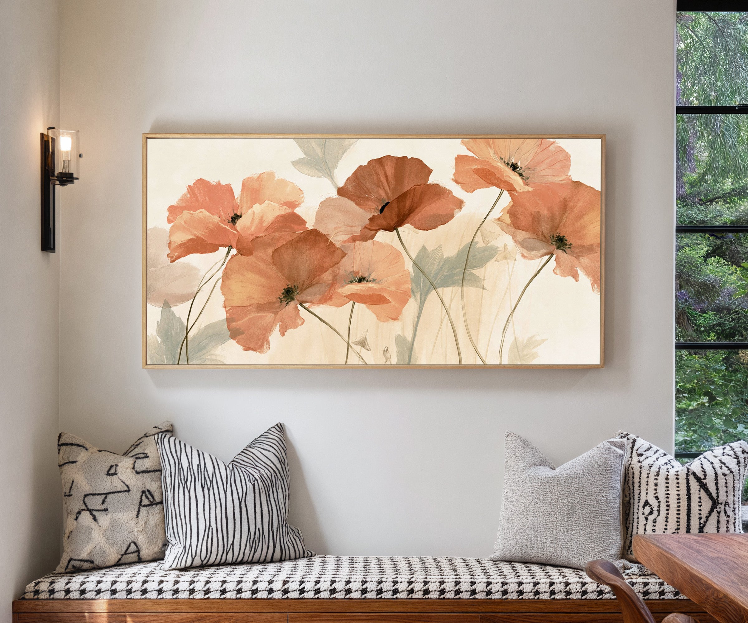 soft coral poppy flowers canvas wall art in a natural wood frame in a living room