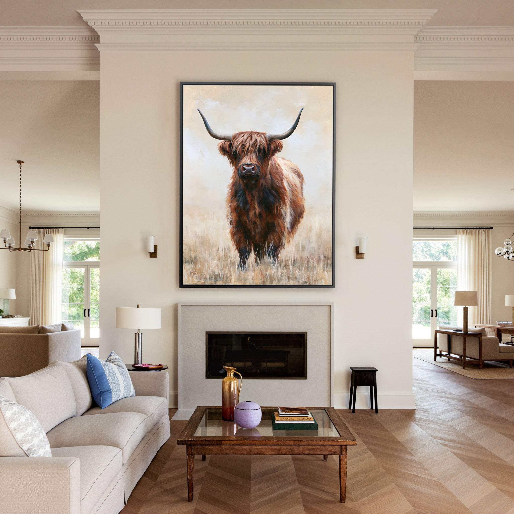 warm brown highland cow in pale dry grass canvas wall art in a black frame above a mantel