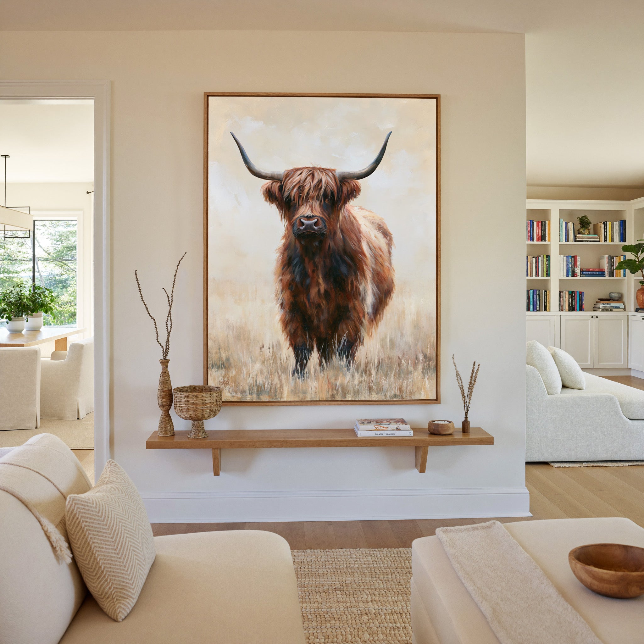 warm brown highland cow in pale dry grass canvas wall art in an oak frame in a living room