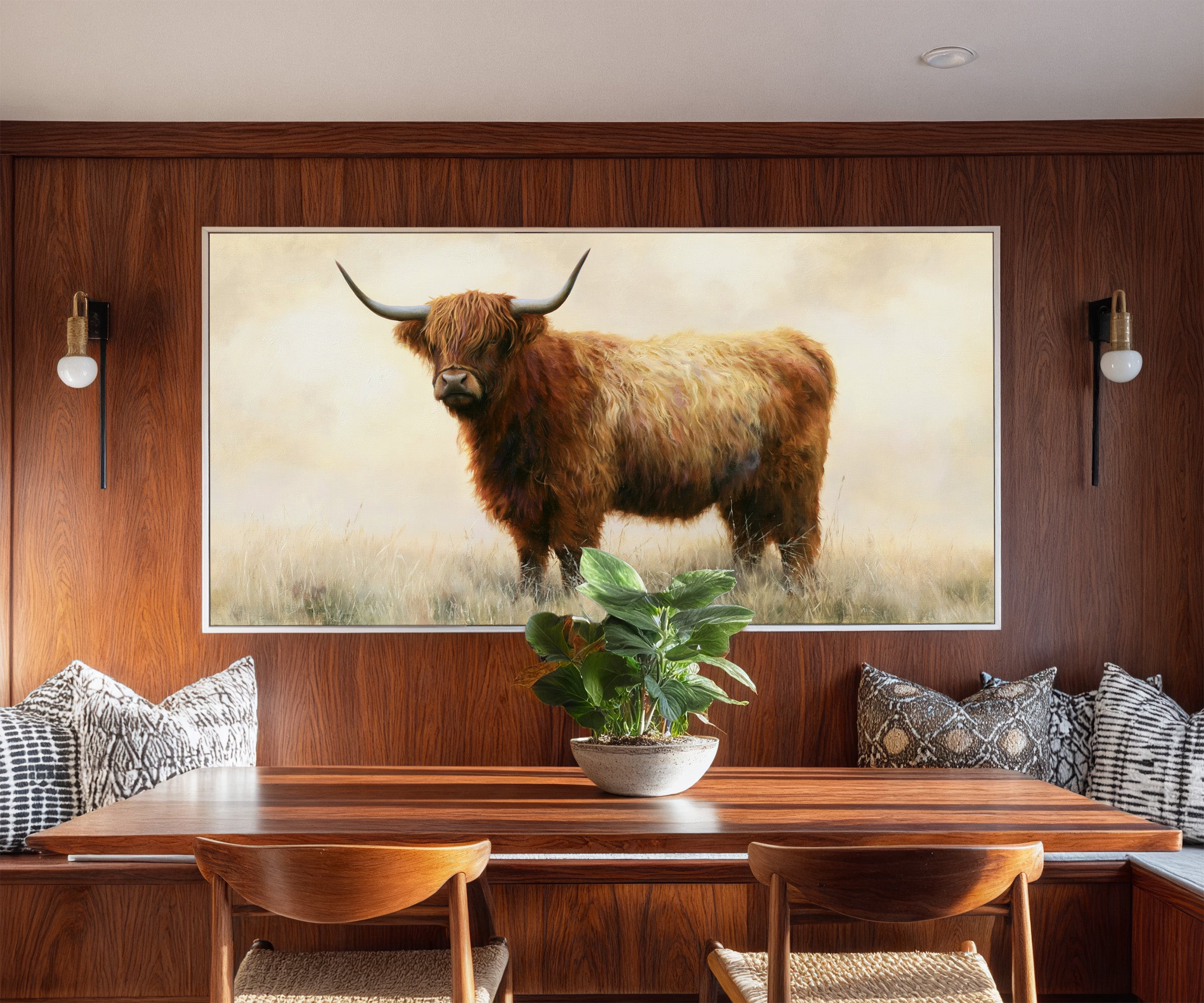 warm brown highland cow in pale dry grass canvas wall art in a white frame in a styled room setting