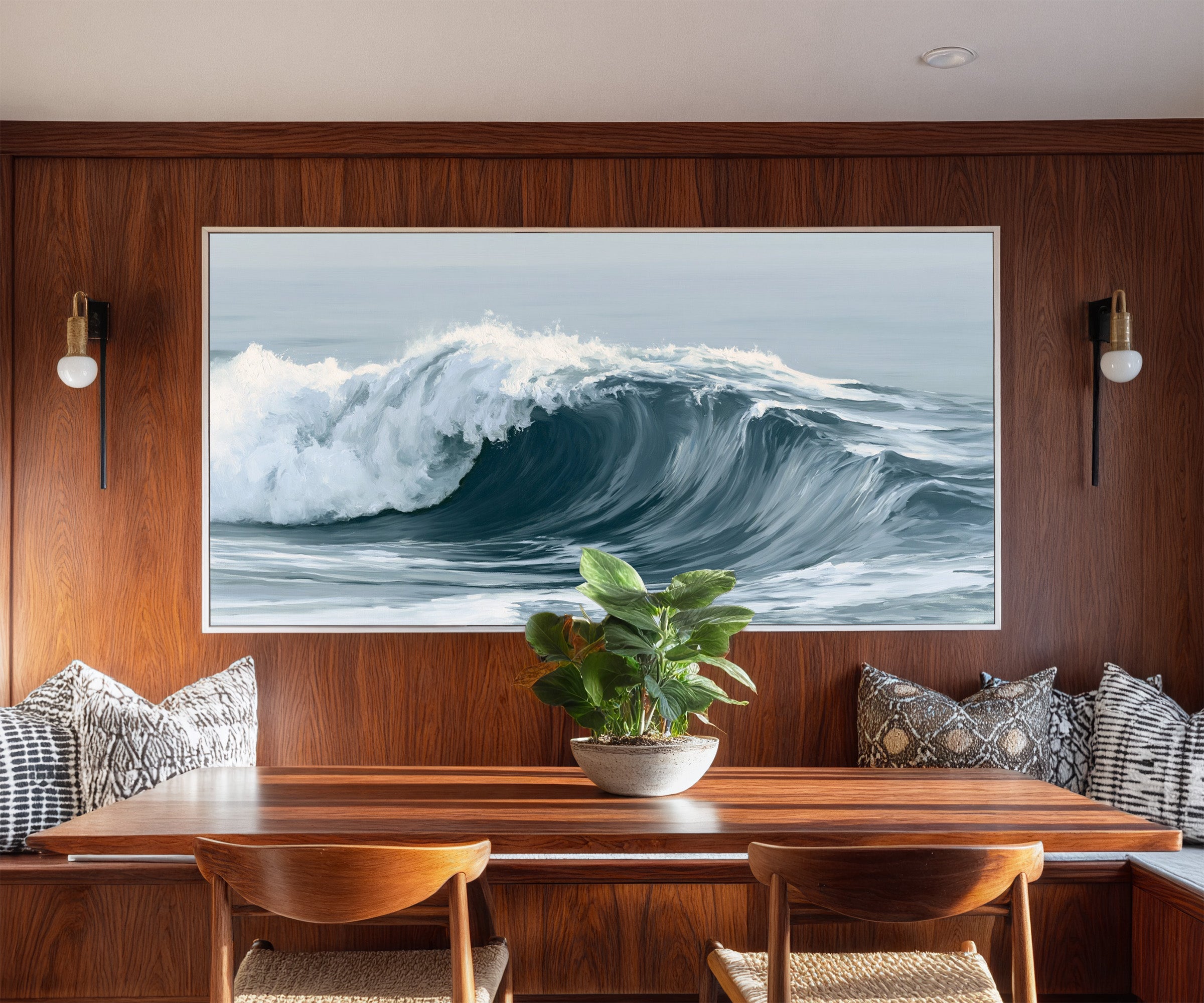 deep muted blue ocean wave canvas wall art in a white frame in a styled room setting