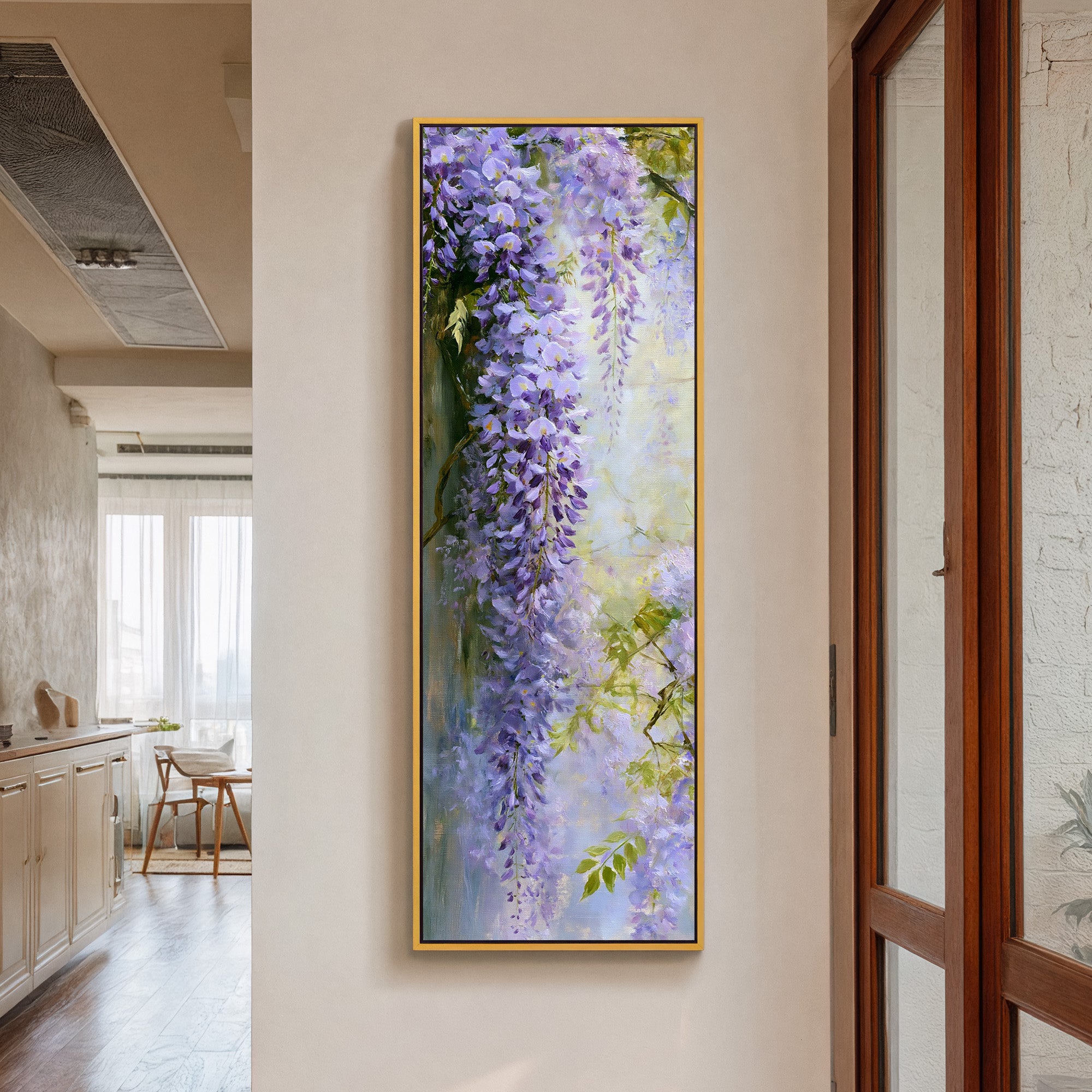 cascading lavender wisteria against a pale canvas wall art in a gold frame in a styled room setting