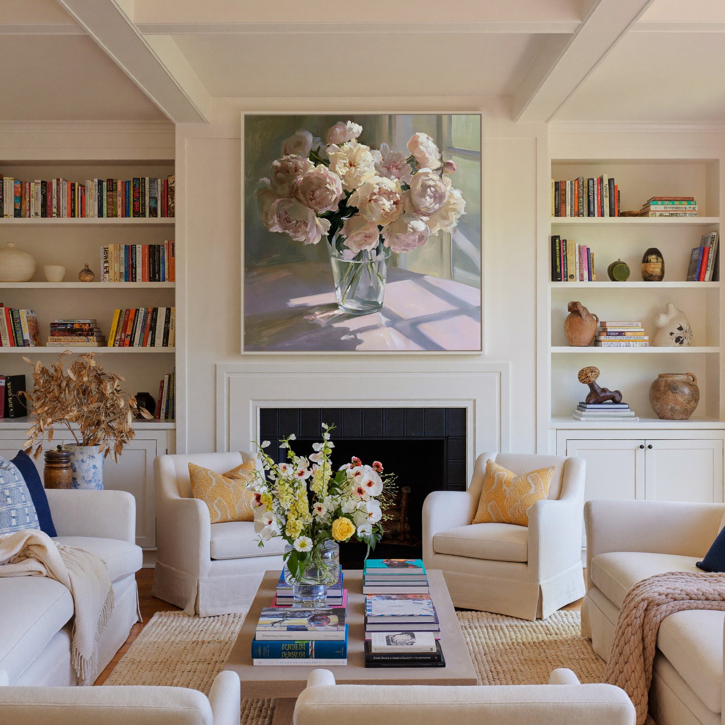 soft blush and cream peony bouquet in a glass canvas wall art in a white frame above a fireplace