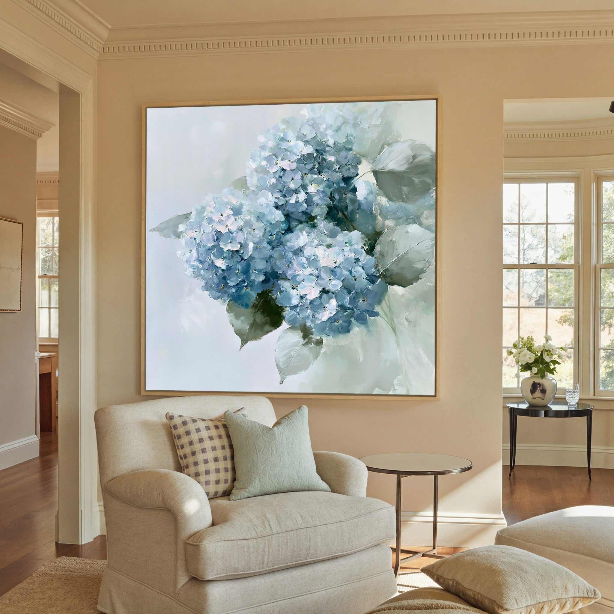 dusty blue hydrangea bouquet with pale green canvas wall art in a natural wood frame in a styled room setting
