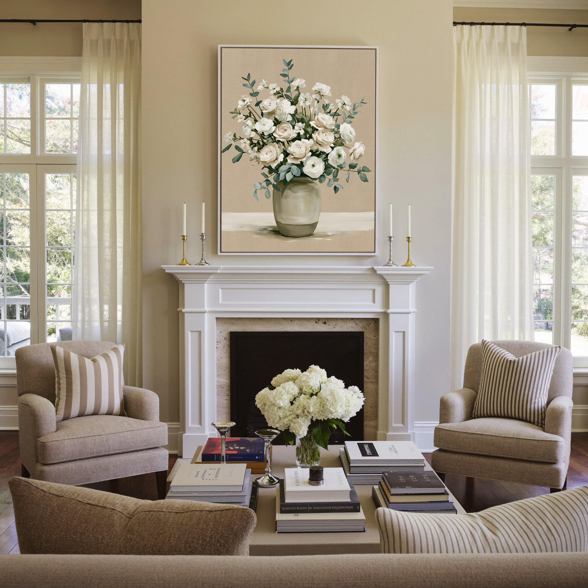 white roses and ranunculus in a glass vase canvas wall art in a white frame above a mantel