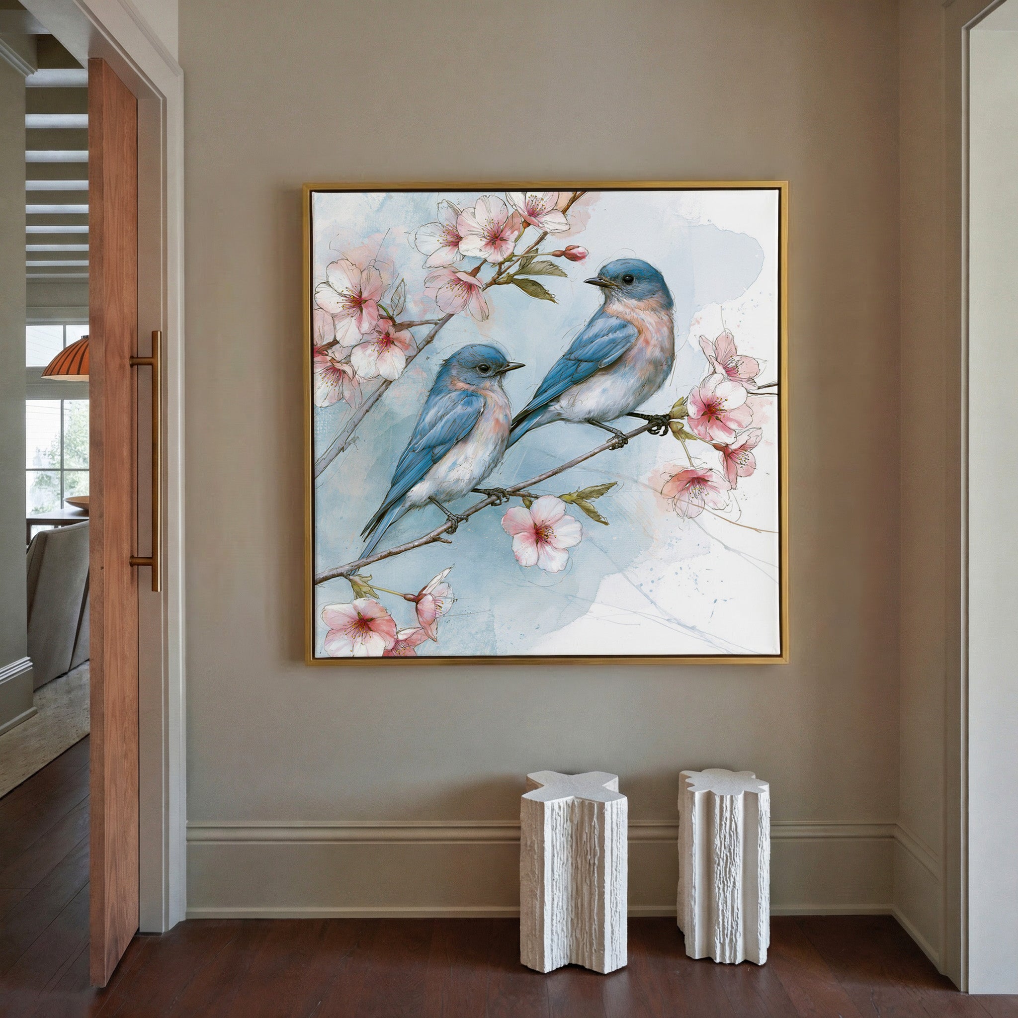 bluebirds on a cherry blossom branch canvas wall art in a gold frame in a styled room setting