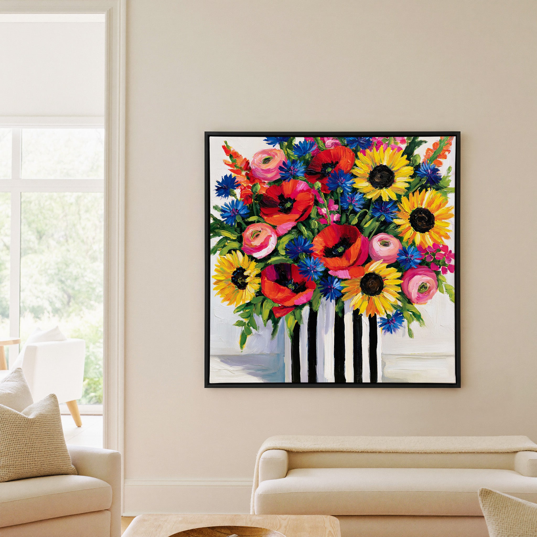 bright wildflower bouquet with poppies, canvas wall art in a black frame in a living room