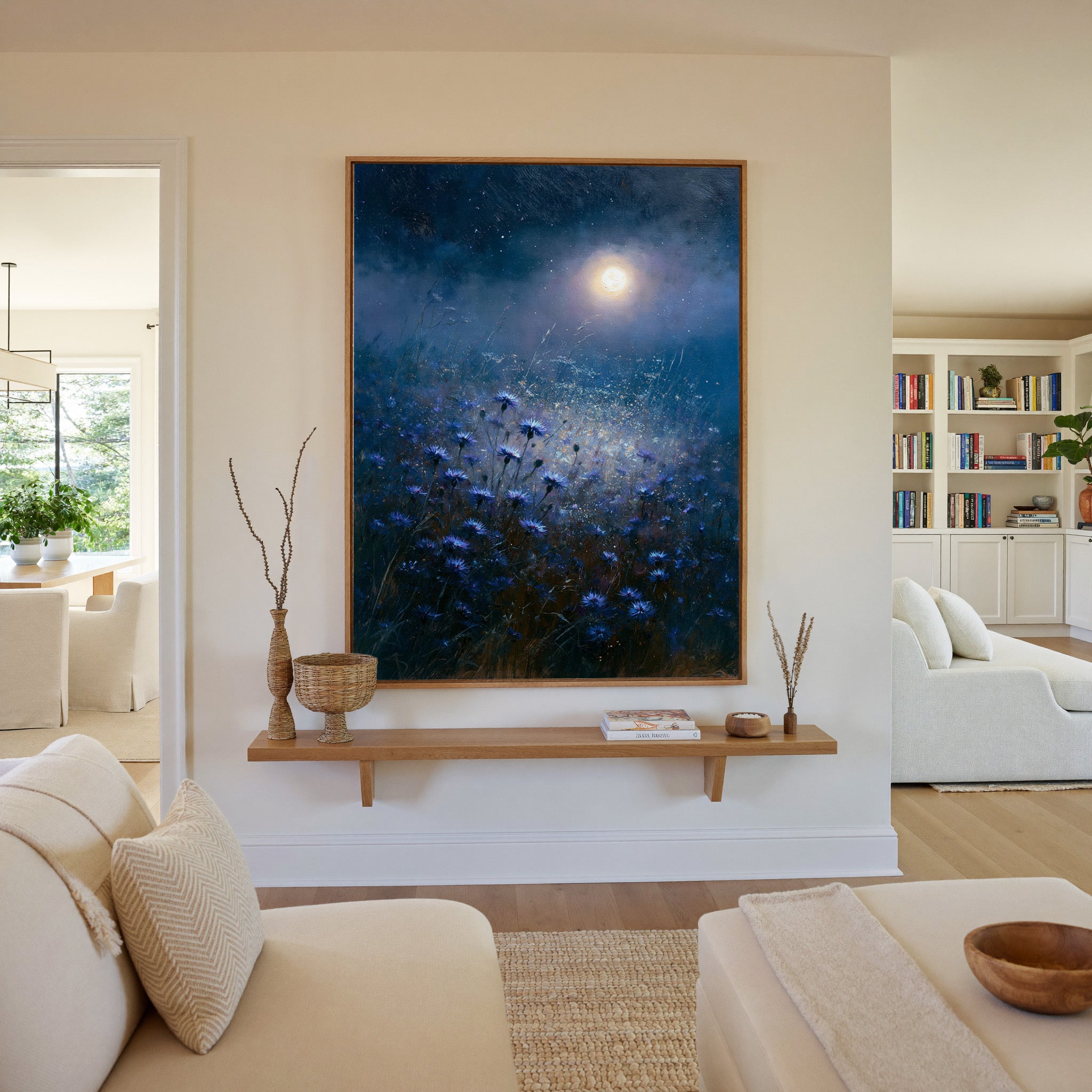 moonlit blue meadow with scattered cornflowers canvas wall art in an oak frame in a living room