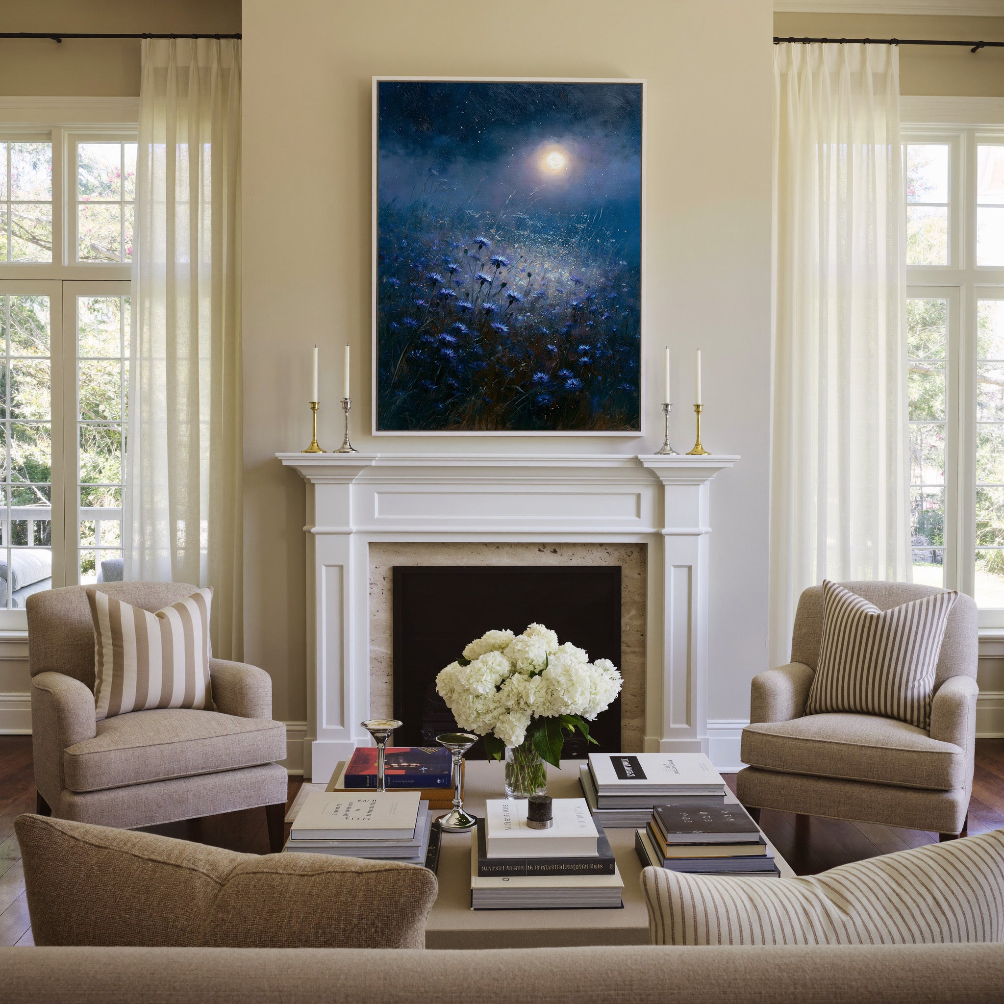 moonlit blue meadow with scattered cornflowers canvas wall art in a white frame above a mantel