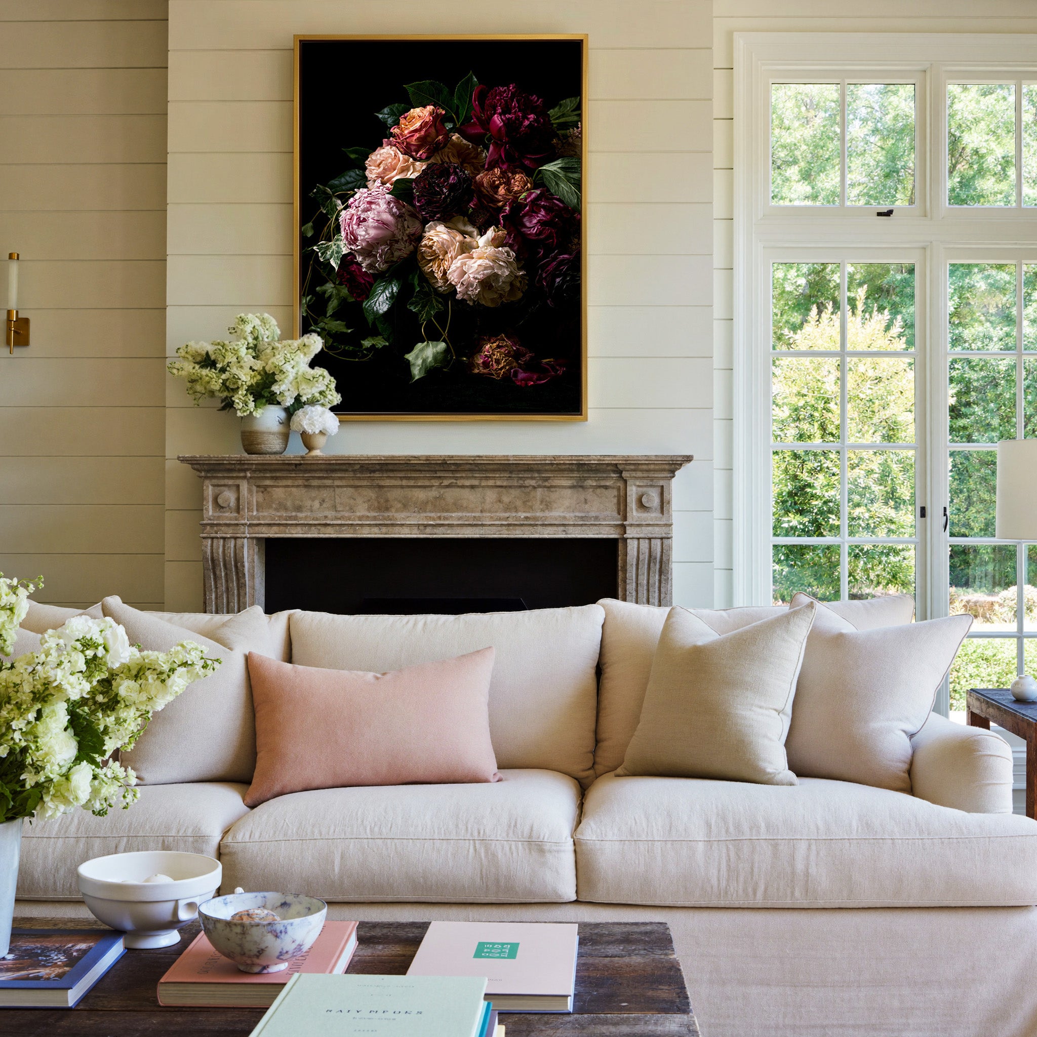 dark floral bouquet with burgundy, blush, and canvas wall art in a gold frame above a mantel