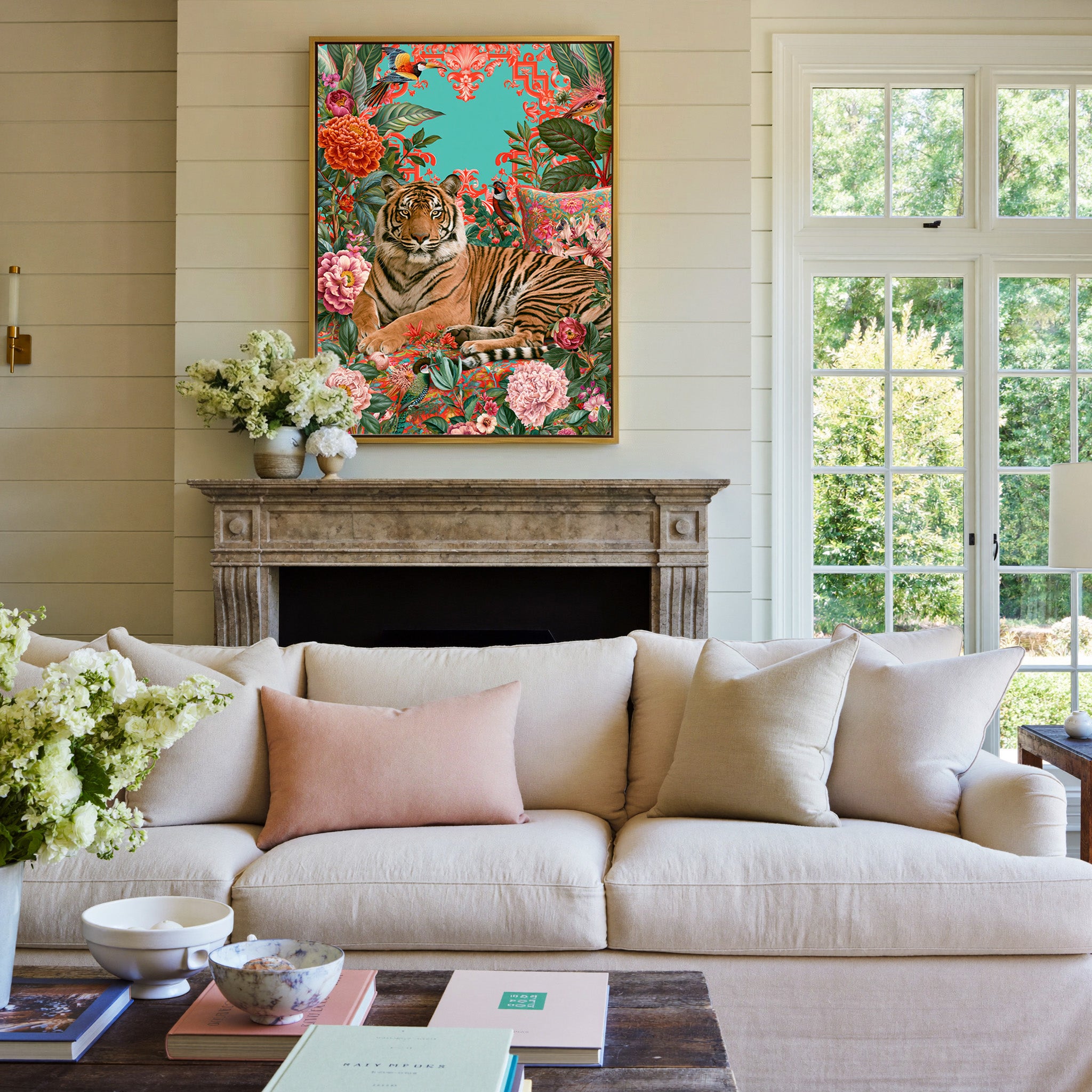 tiger among coral florals and teal foliage canvas wall art in a gold frame above a mantel